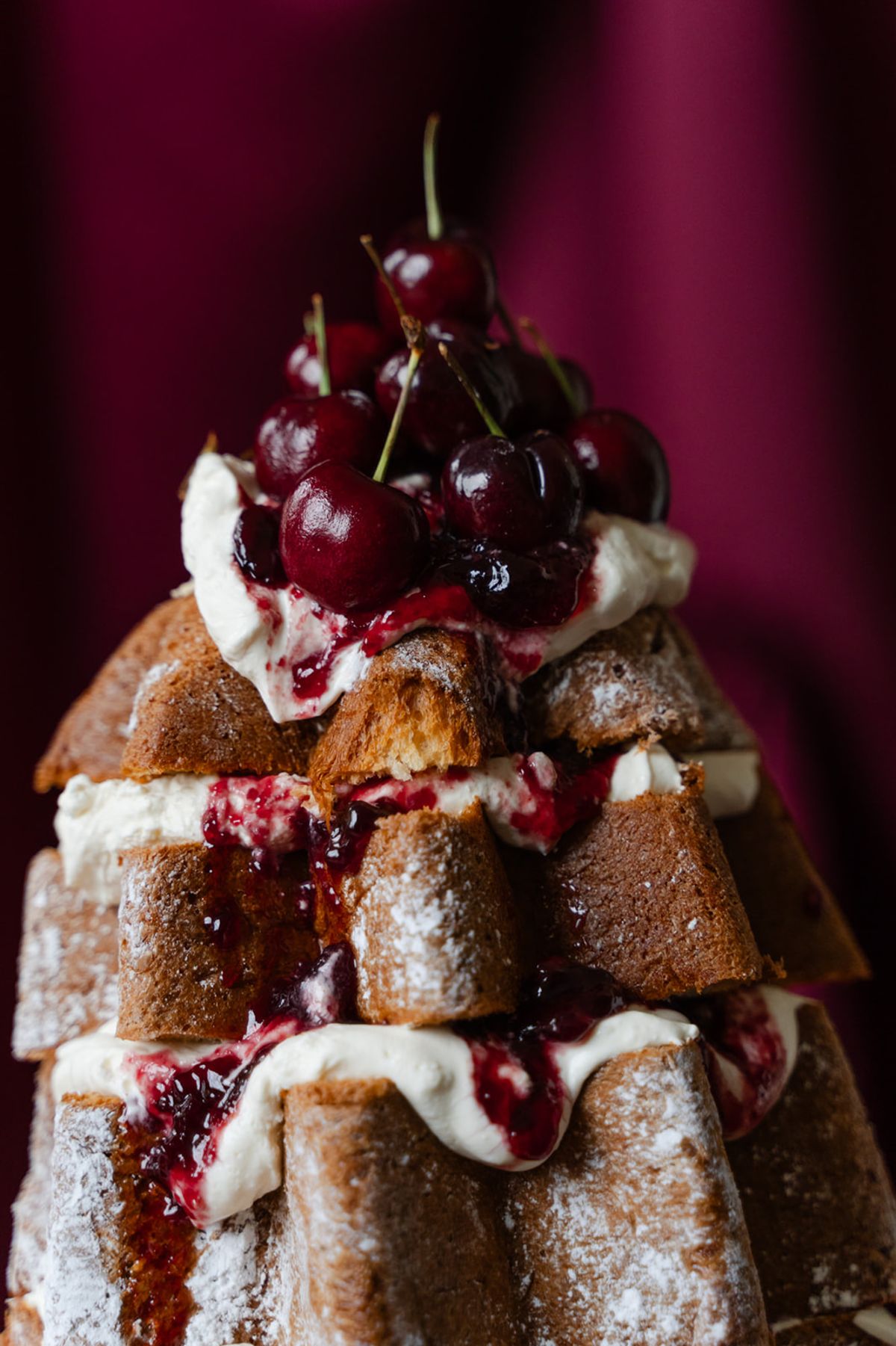 Pandoro tower wedding cake with cream and cherries at Domaine des Halles