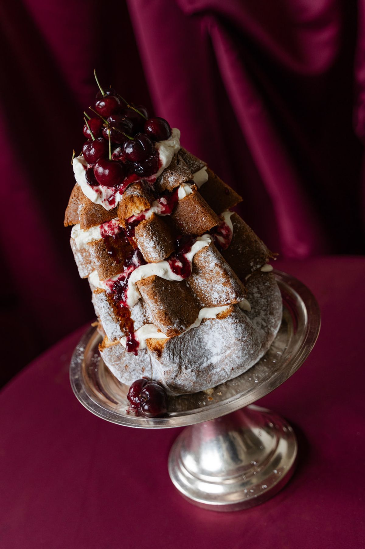 Pandoro tower wedding cake on silver pedestal at Domaine des Halles