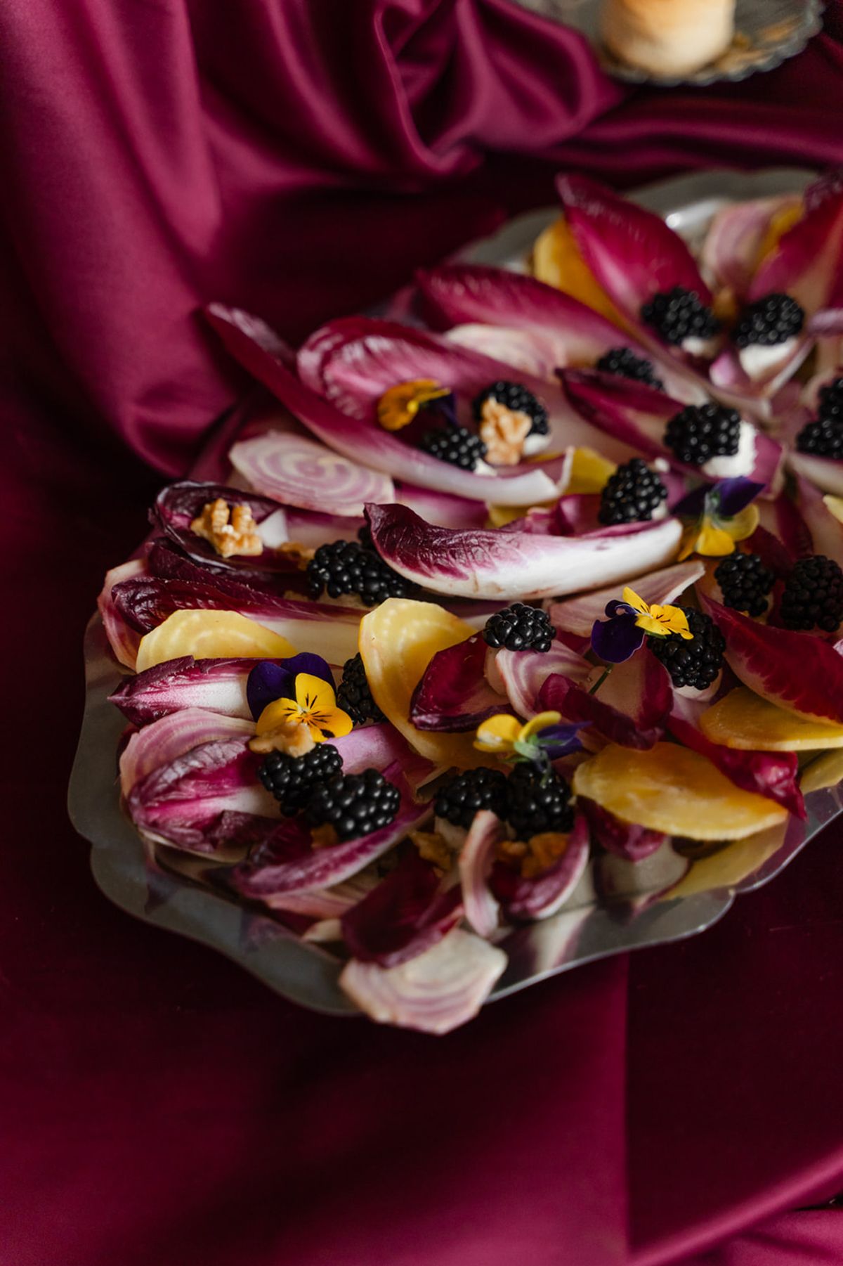 Radicchio and blackberry salad on silver platter at Domaine des Halles wedding