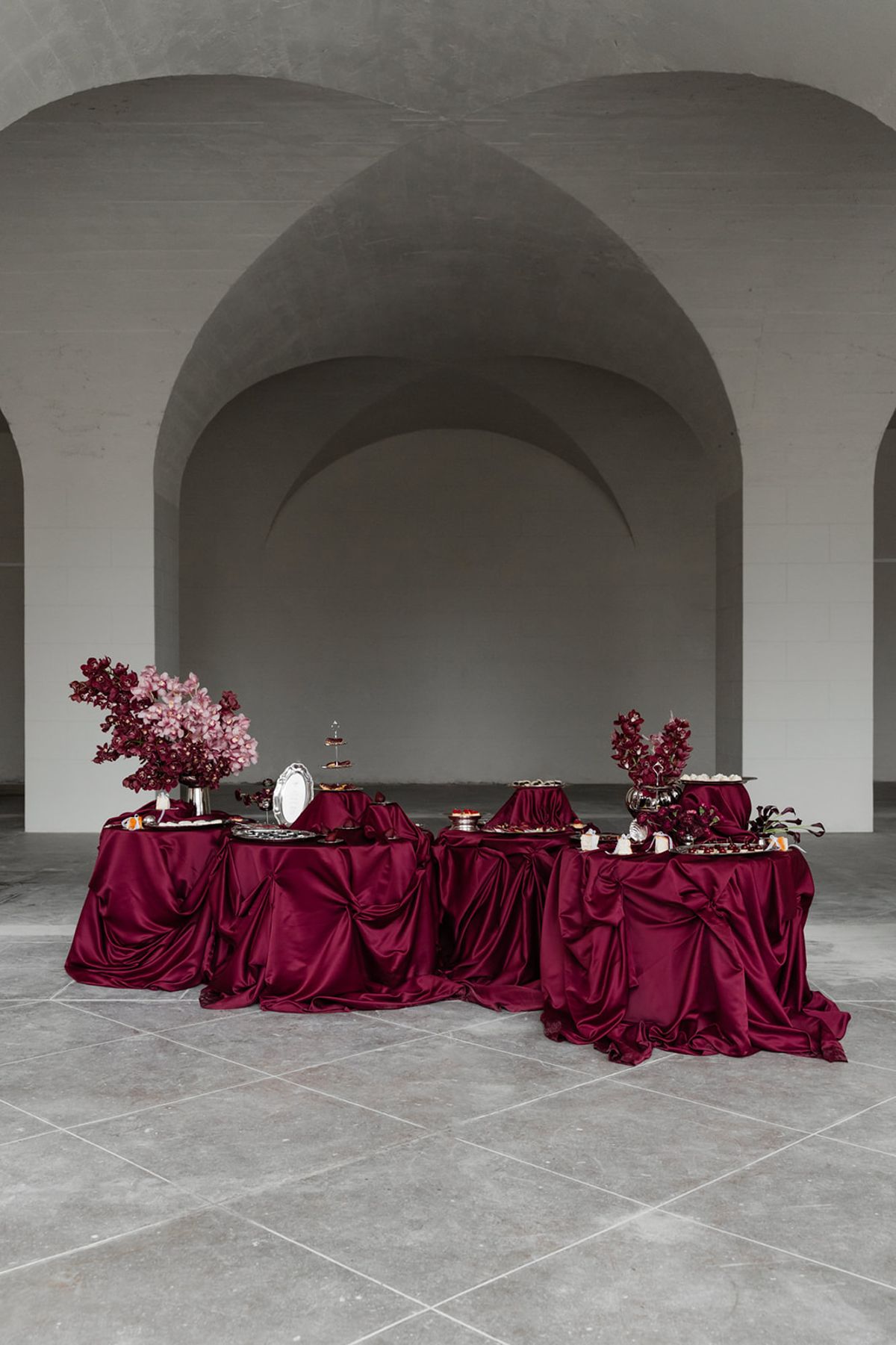 Reception buffet of food on red linen at Domaine des Halles