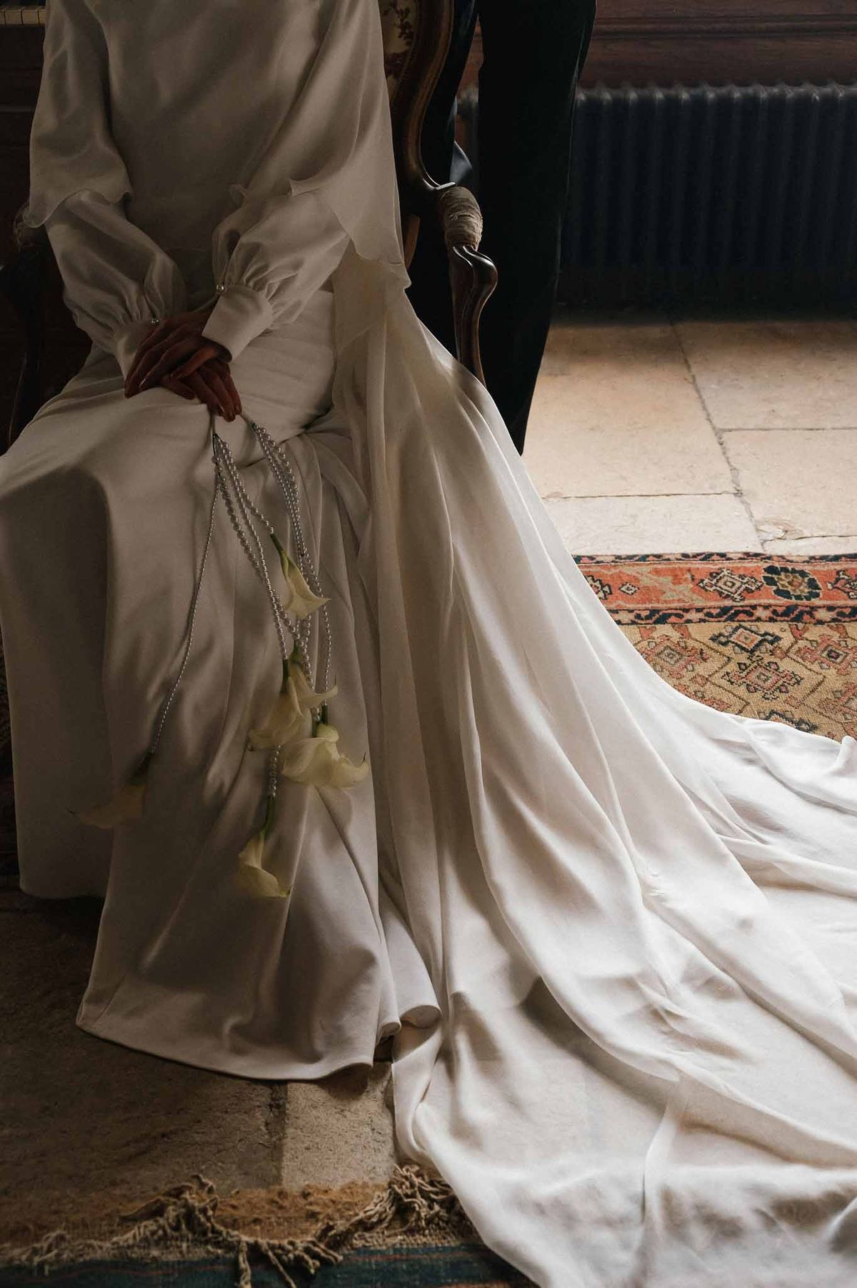 Bride with train on Persian rug at Chateau d'Hazeville