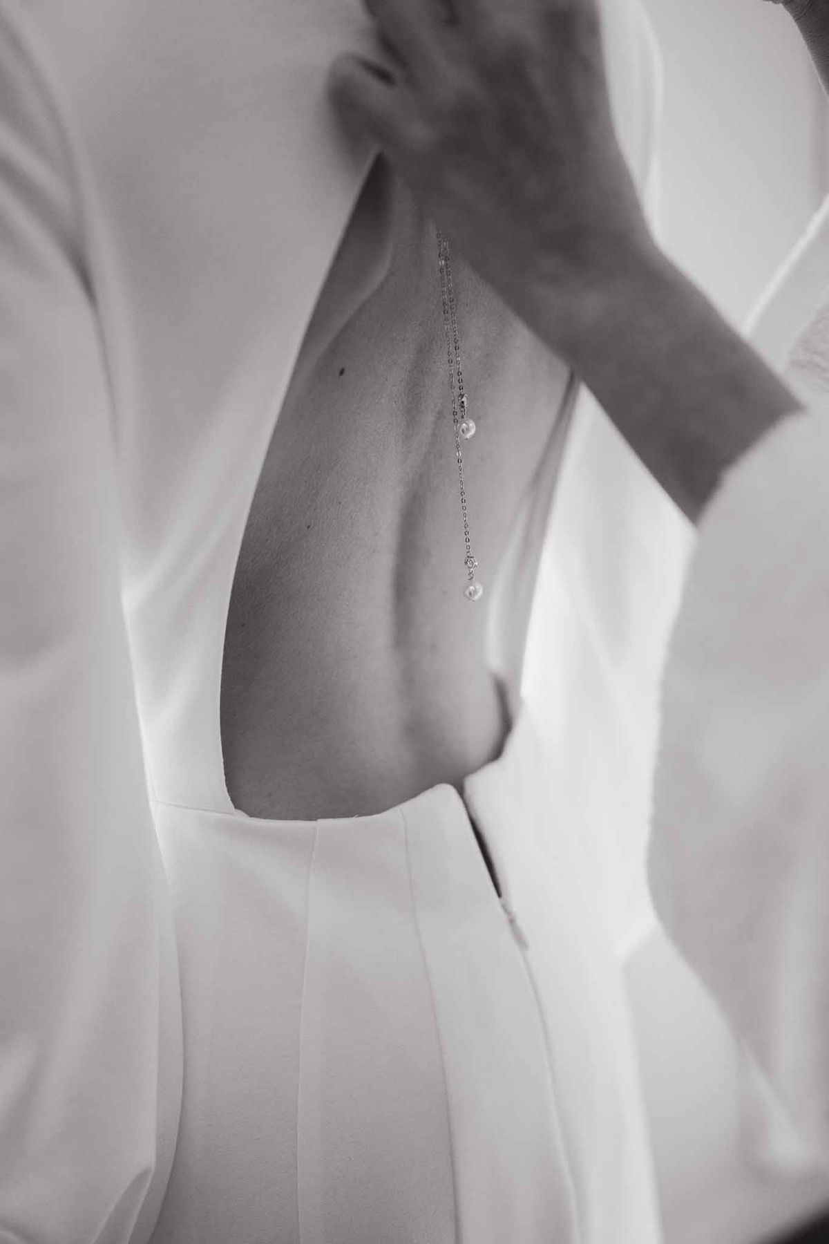 Bridal gown and pearl necklace detail at Chateau d'Hazeville