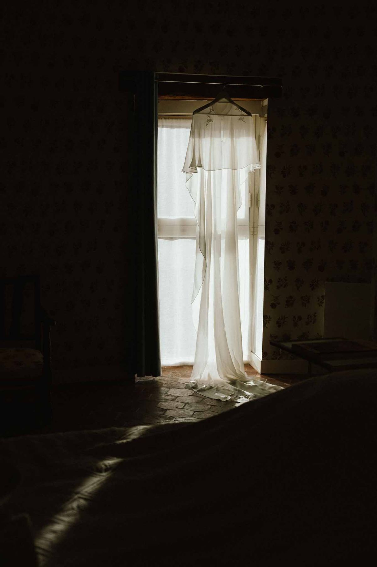 Bridal veil hanging in bedroom doorway at Chateau d'Hazeville