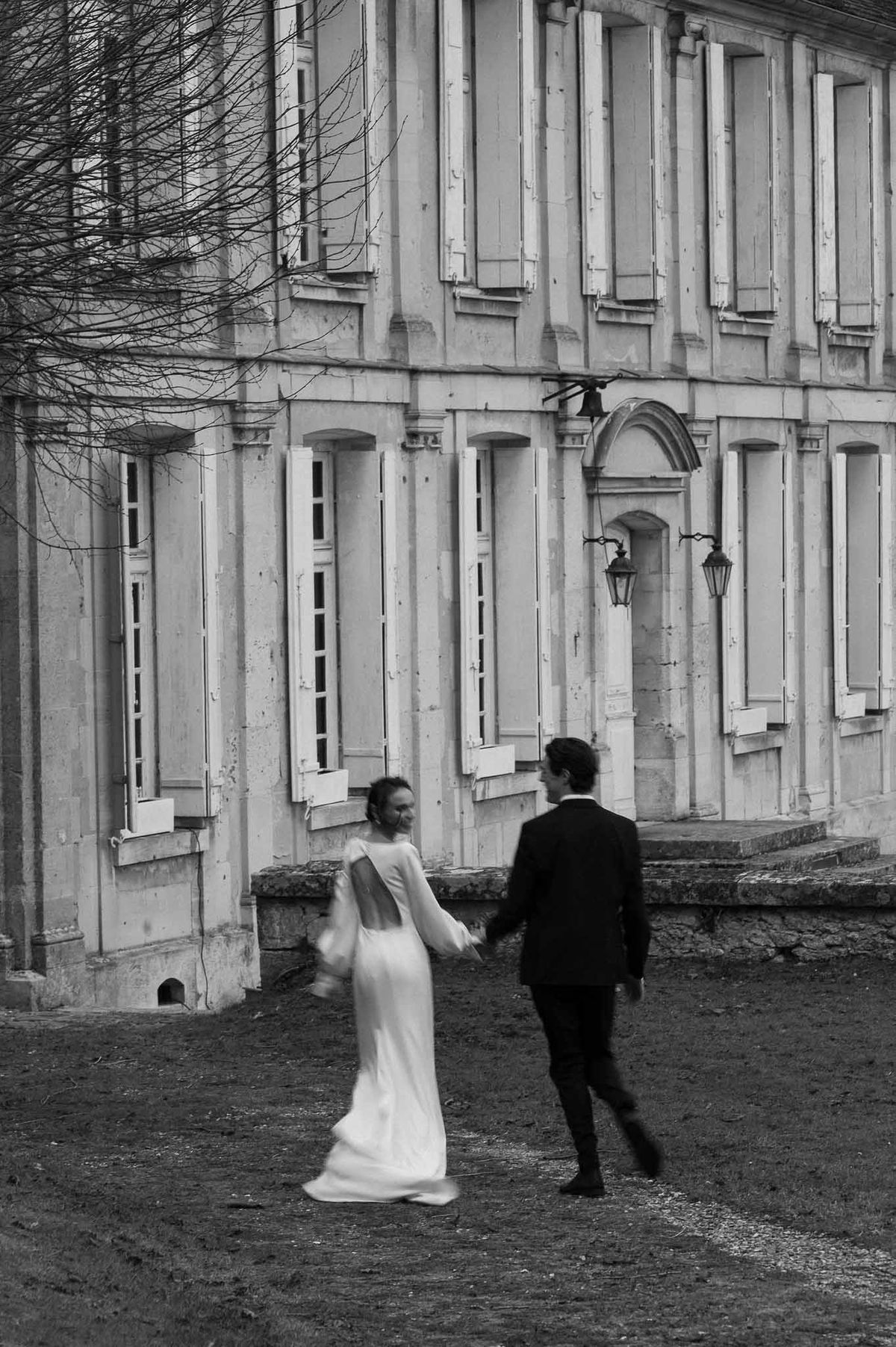 Couple walking toward chateau at Chateau d'Hazeville