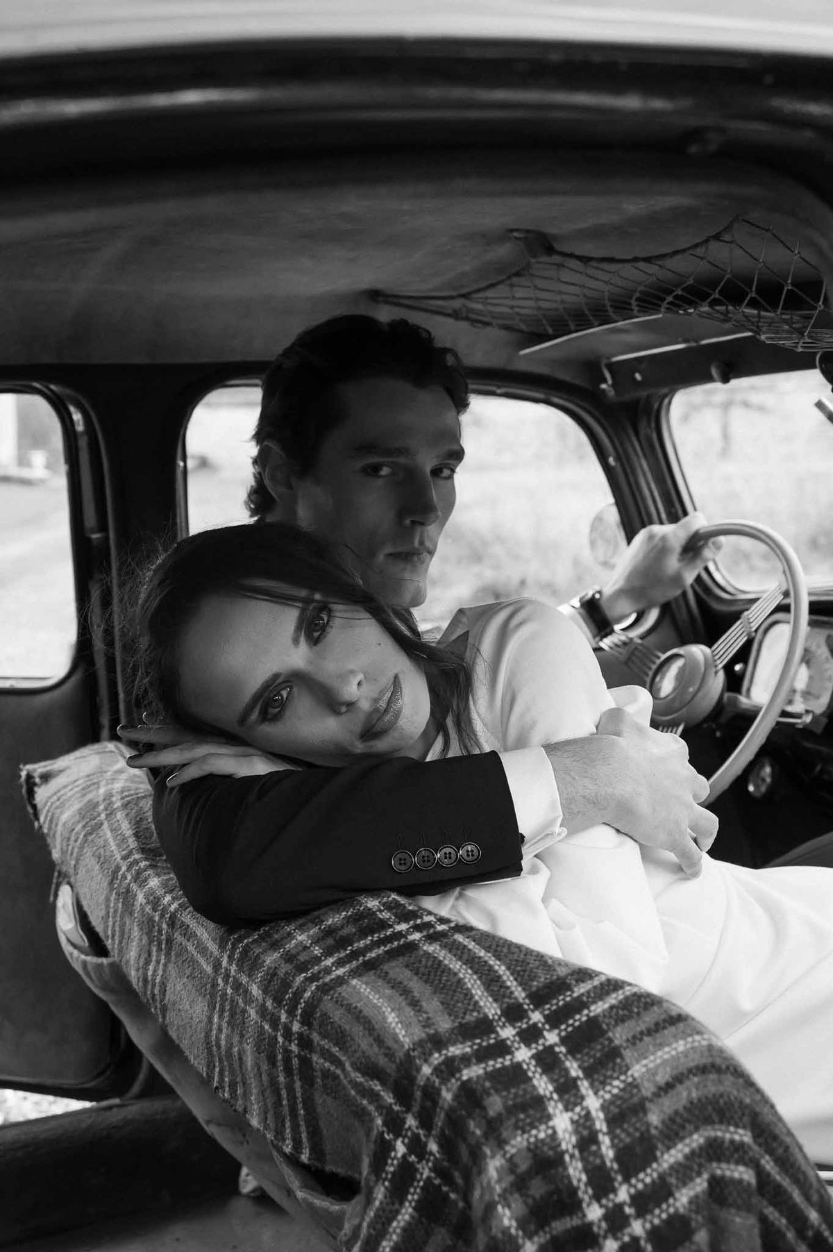 Couple in vintage car interior at Chateau d'Hazeville