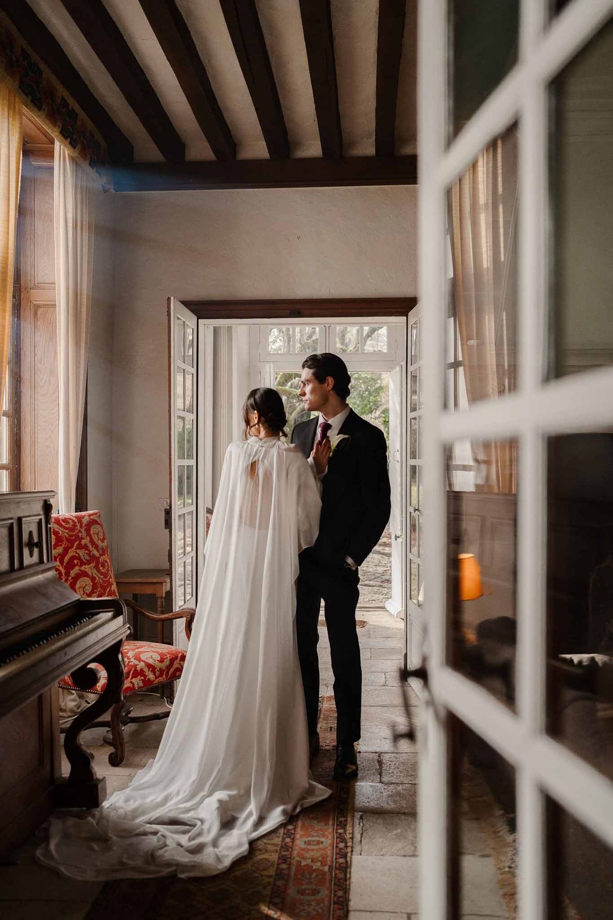 Couple in French doorway at Chateau d'Hazeville