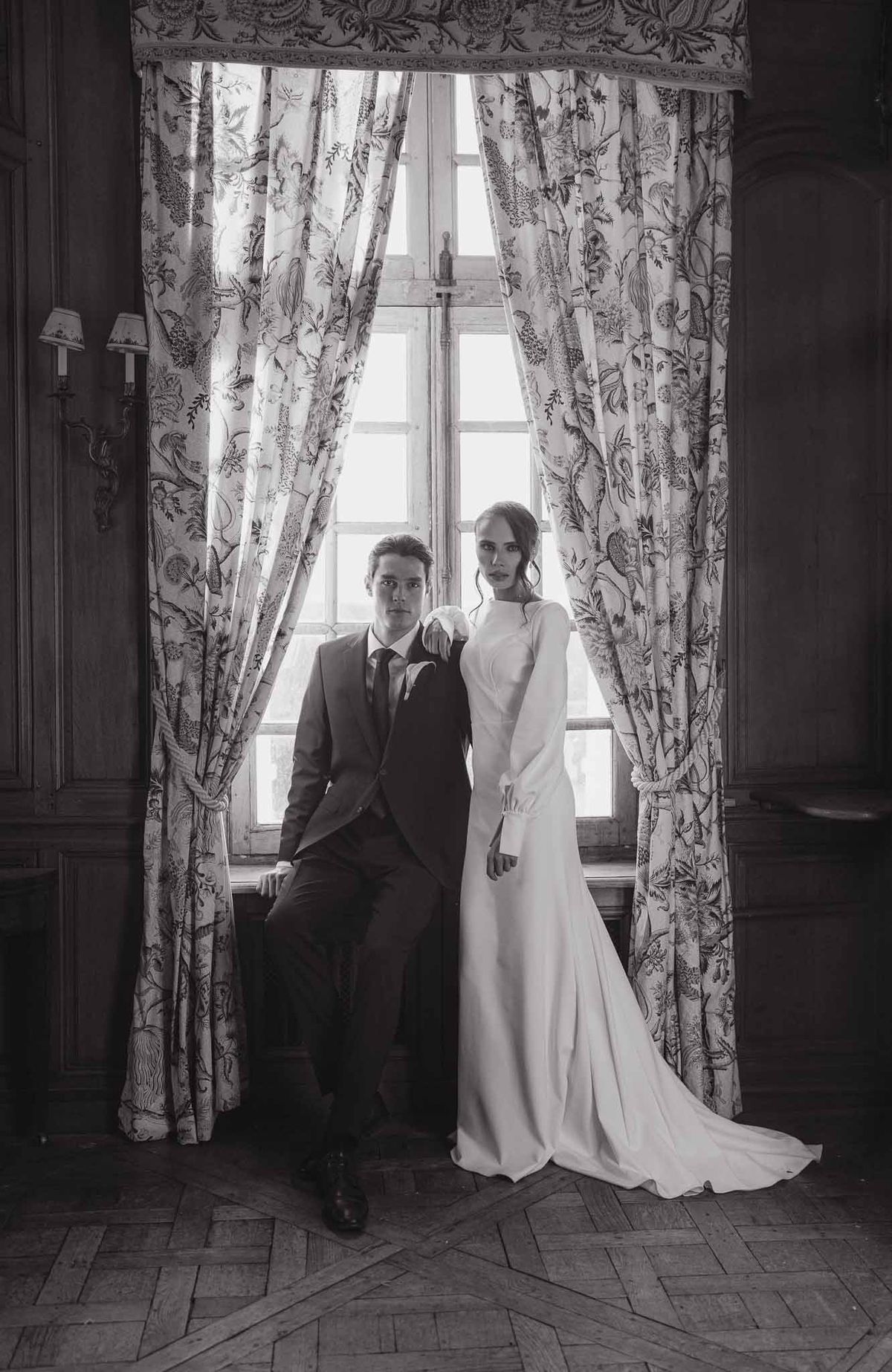 Couple portrait by window at Chateau d'Hazeville