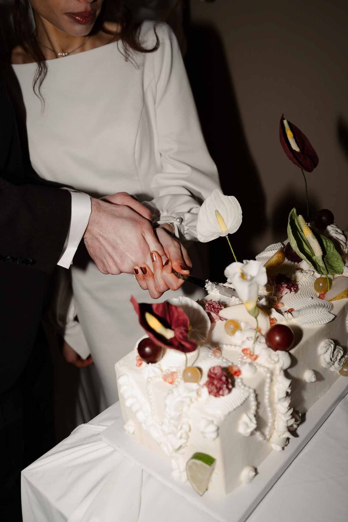 Couple cutting artistic wedding cake at Chateau d'Hazeville