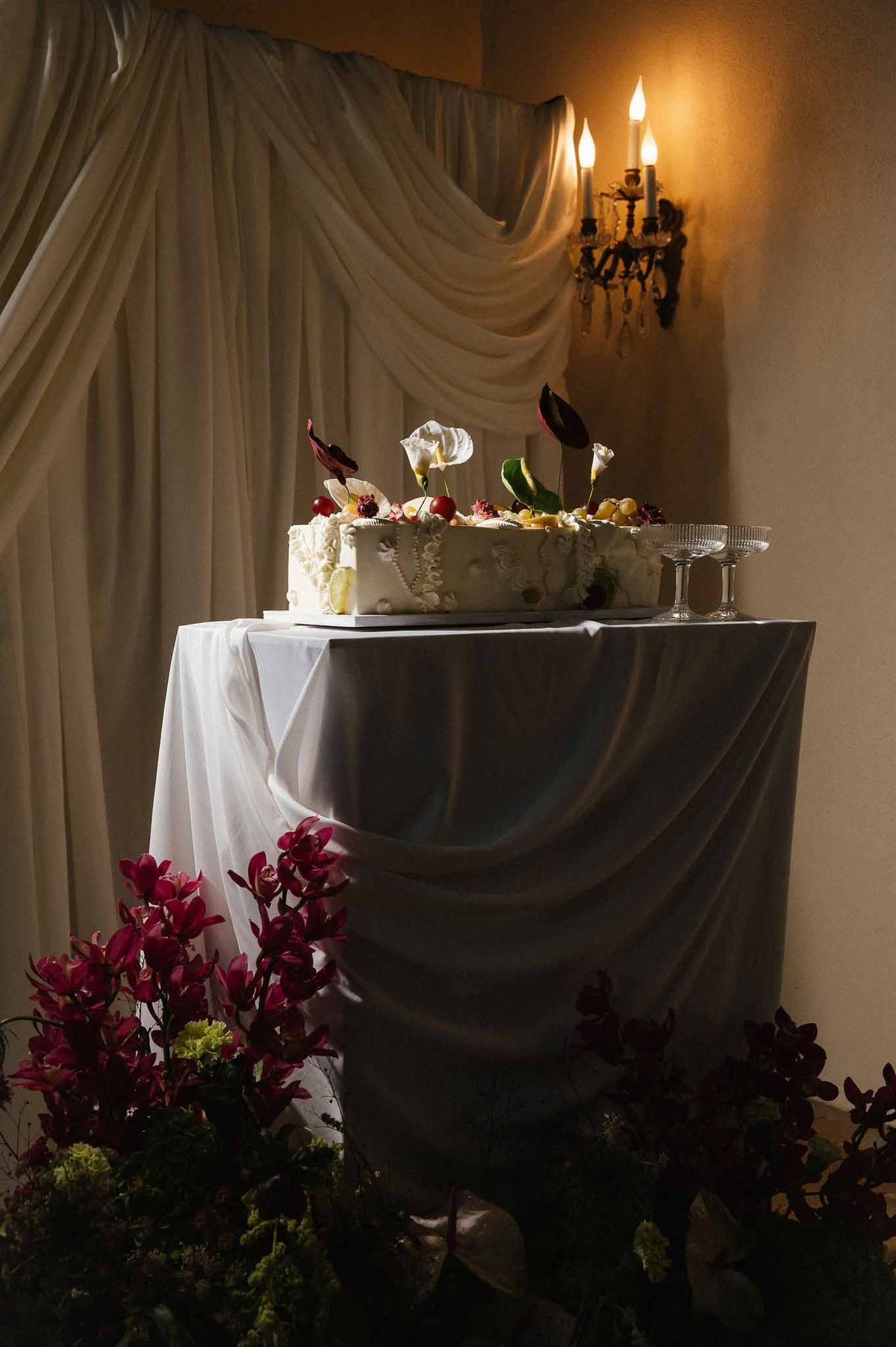 Wedding cake display with orchids at Chateau d'Hazeville