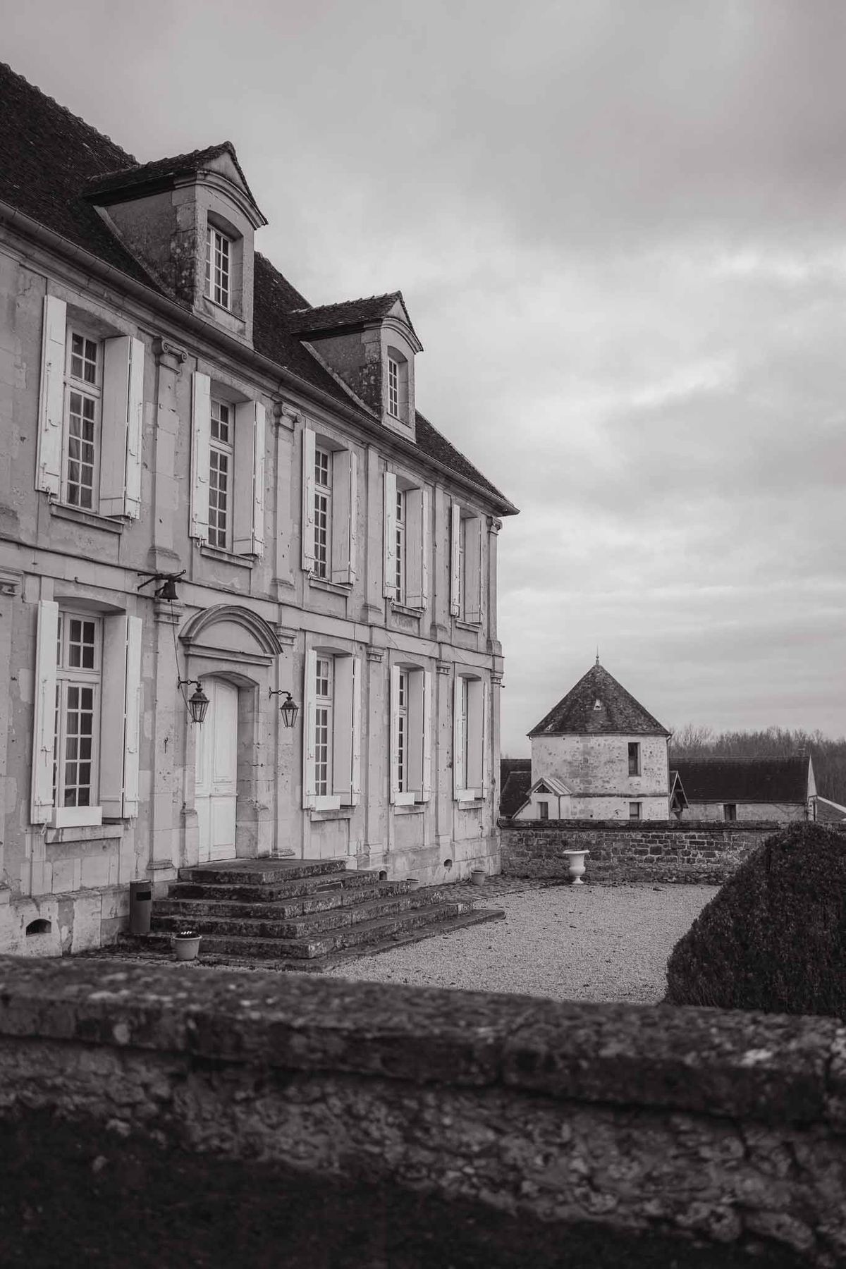 Chateau d'Hazeville exterior with round tower in black and white