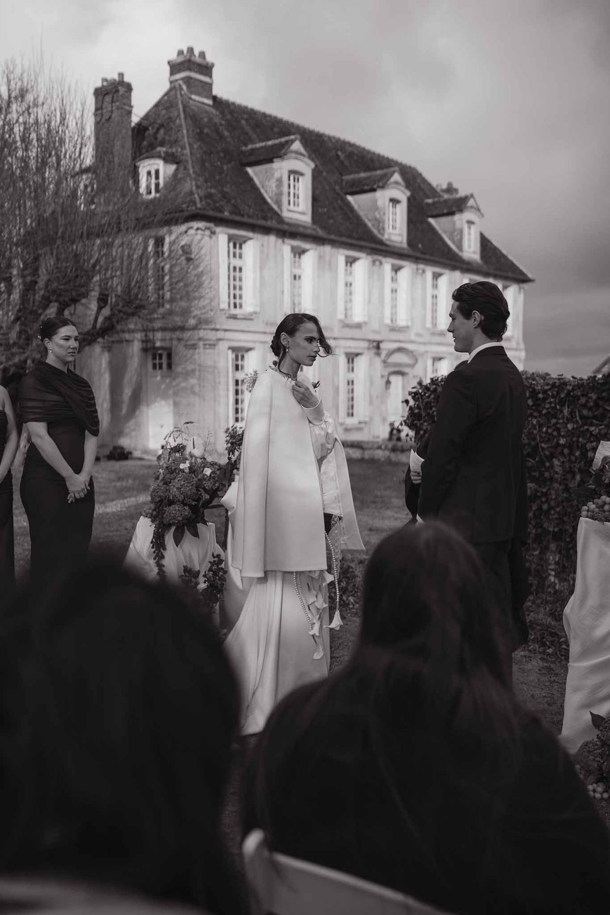 Outdoor ceremony with chateau backdrop at Chateau d'Hazeville