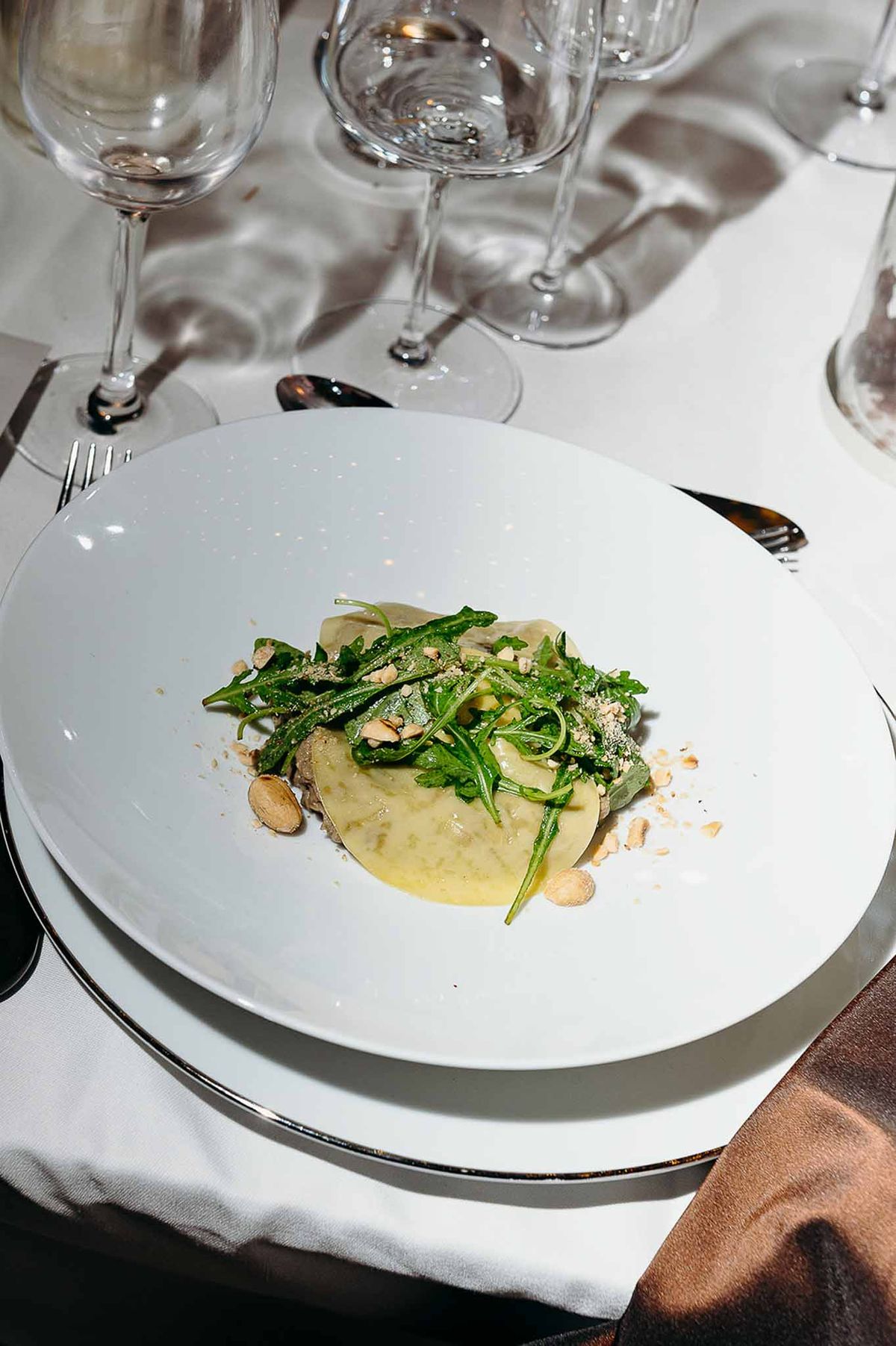 Reception dinner guests being served their plates at Domaine de Perrotin