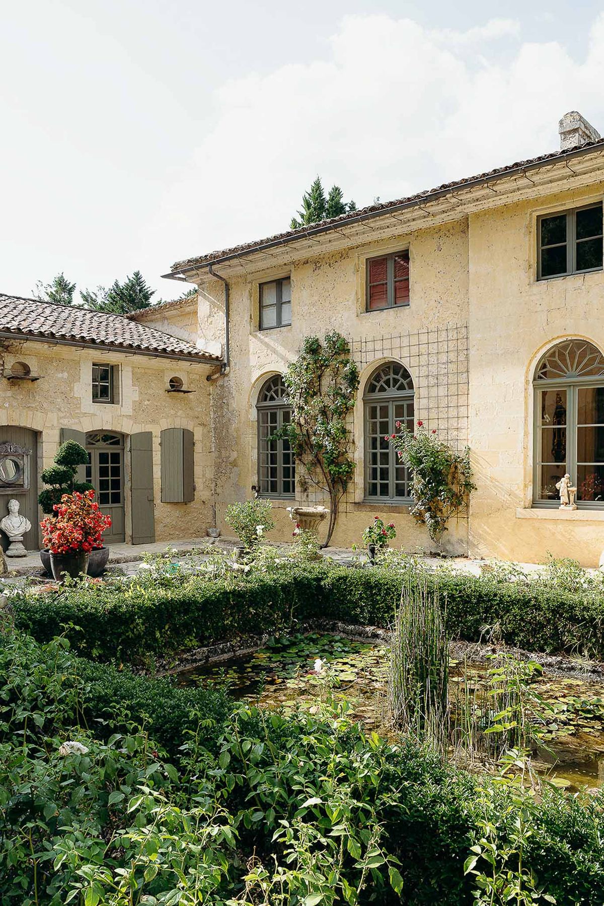 Pond and vintage luxury grounds at Domaine de Perrotin
