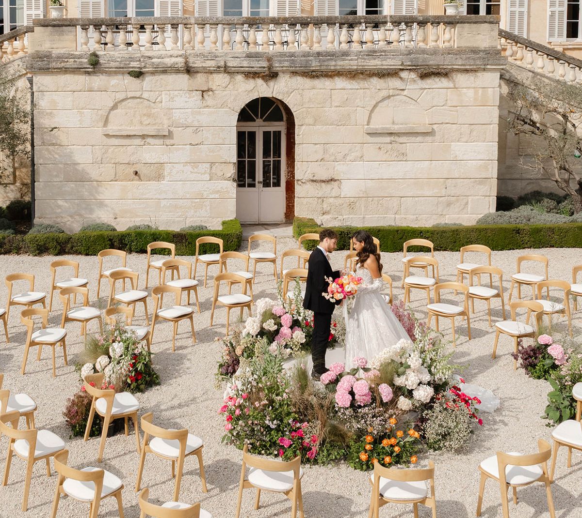 Spiral Ceremony, Pink Blooms and Crystal Chandeliers at Château Martinay