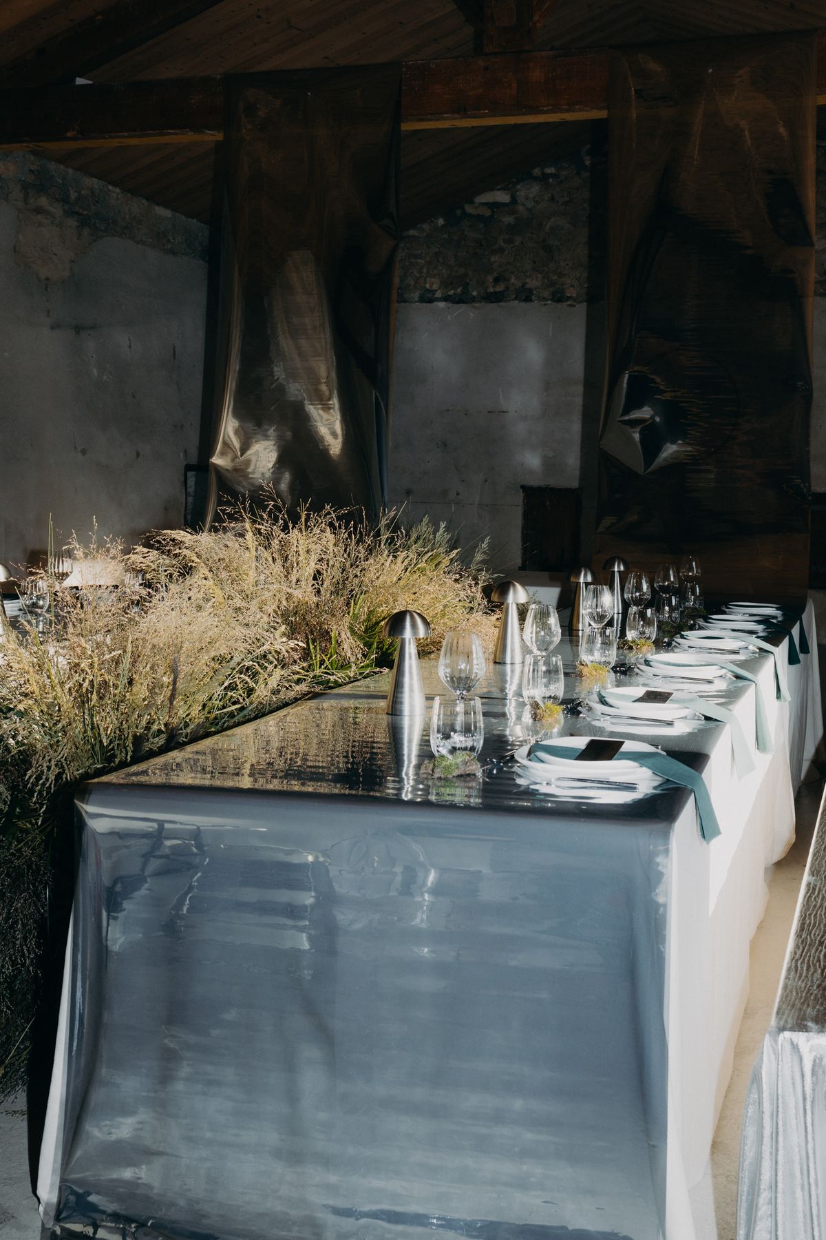 Chrome reception table detail with glassware and moss