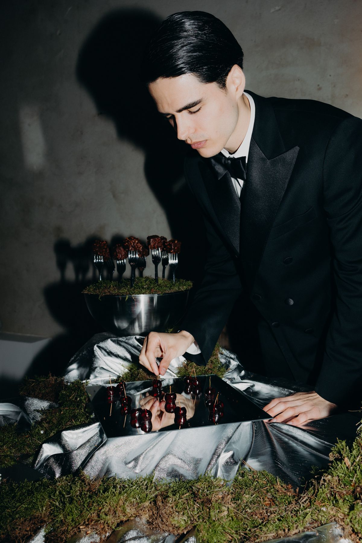 Groom serving dessert at the reception table