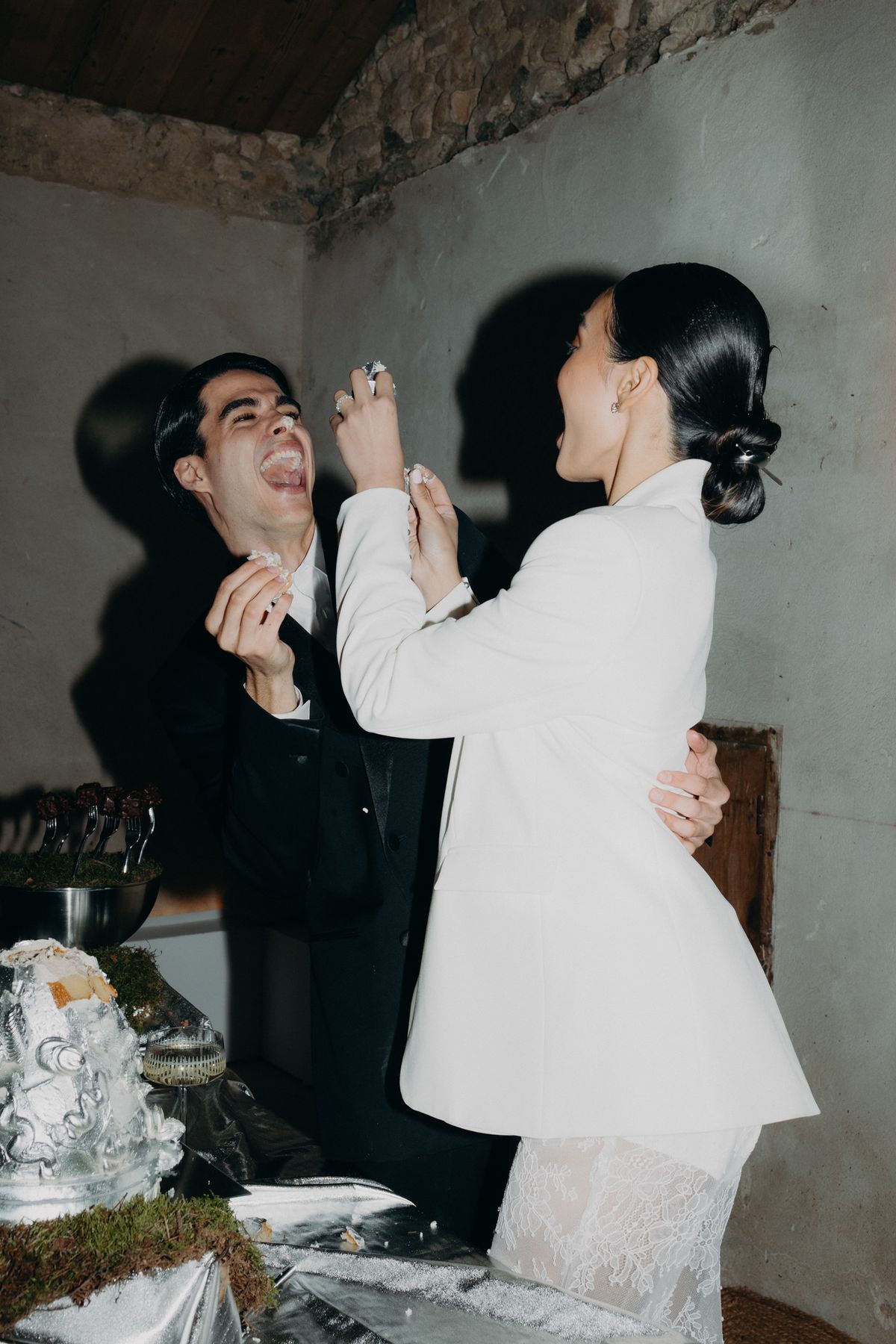 Bride and groom sharing cake