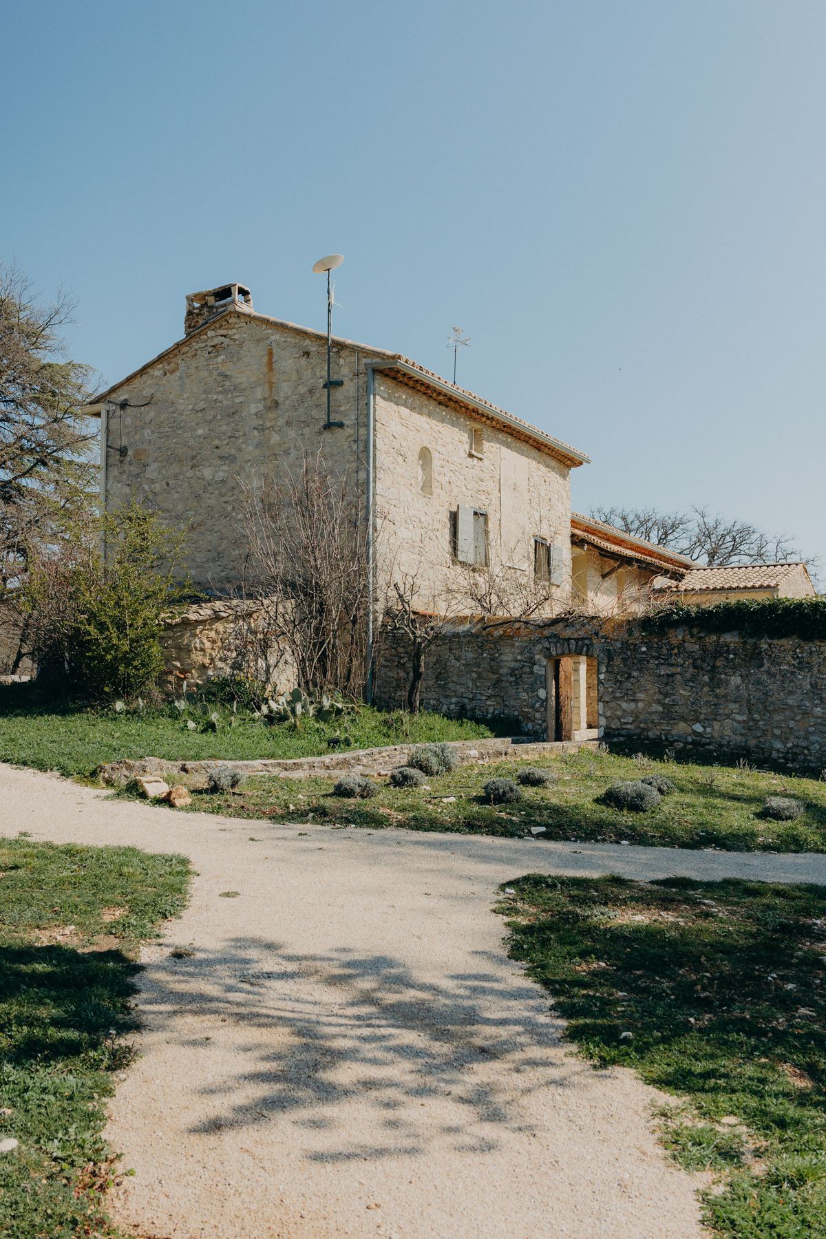 Stone facade and gravel drive at Les Hauts de Sénanque in Provence