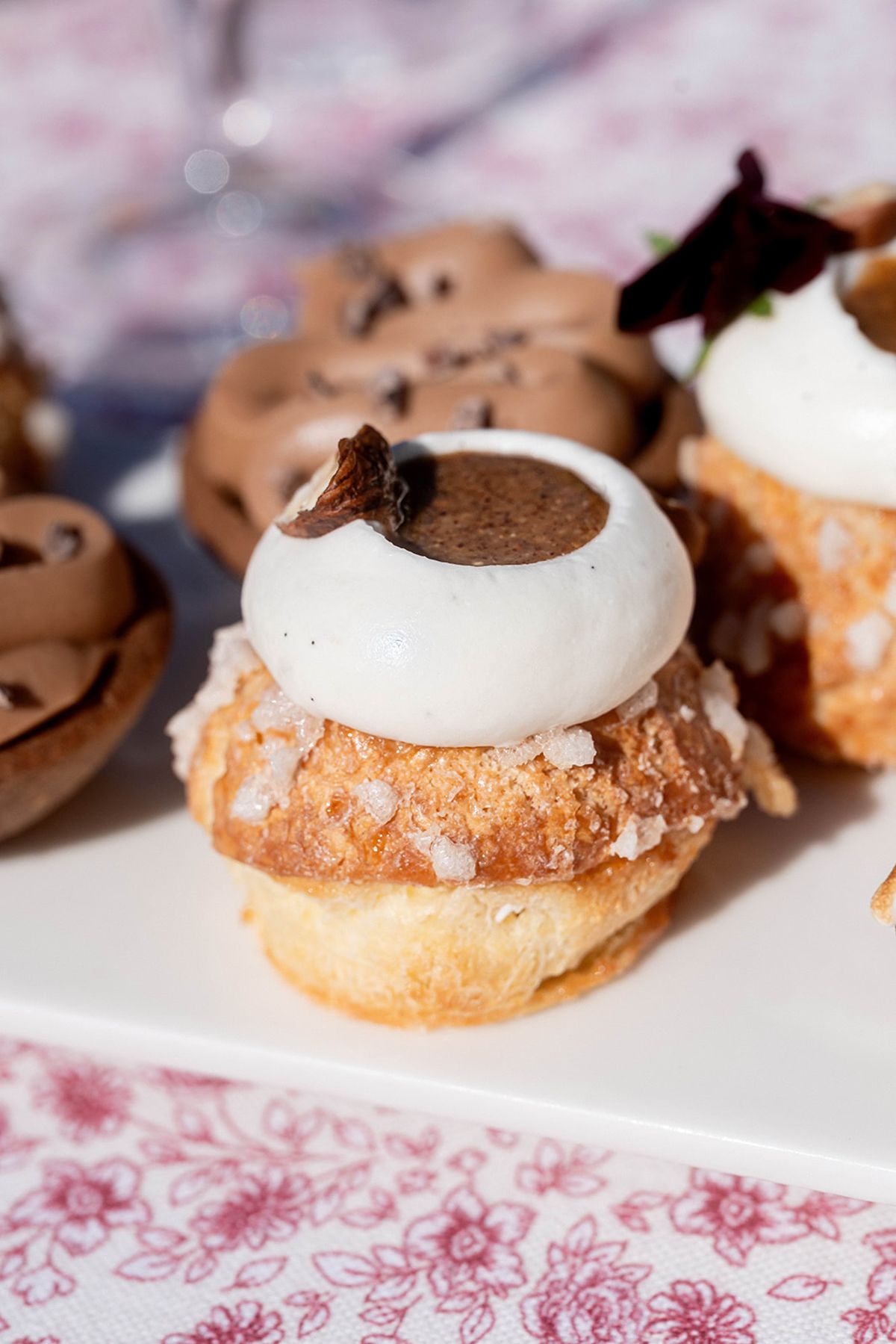 Choux pastries and desserts on a serving plate