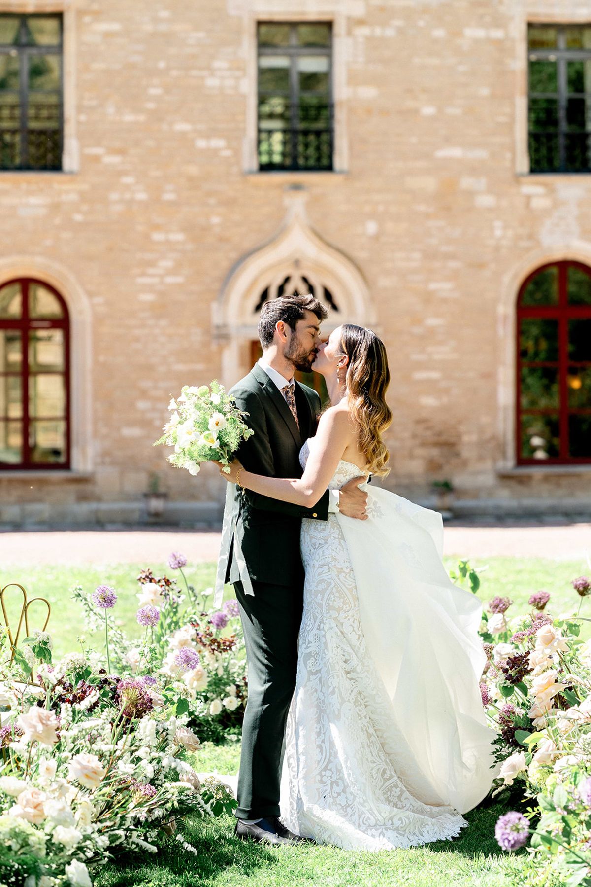 The couple kissing in the abbey gardens