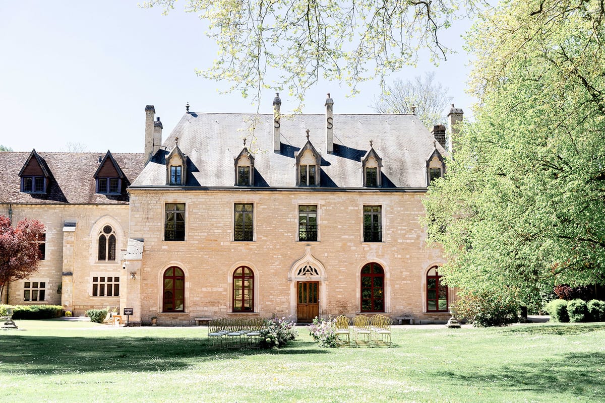The abbey's stone facade and lawns in late spring