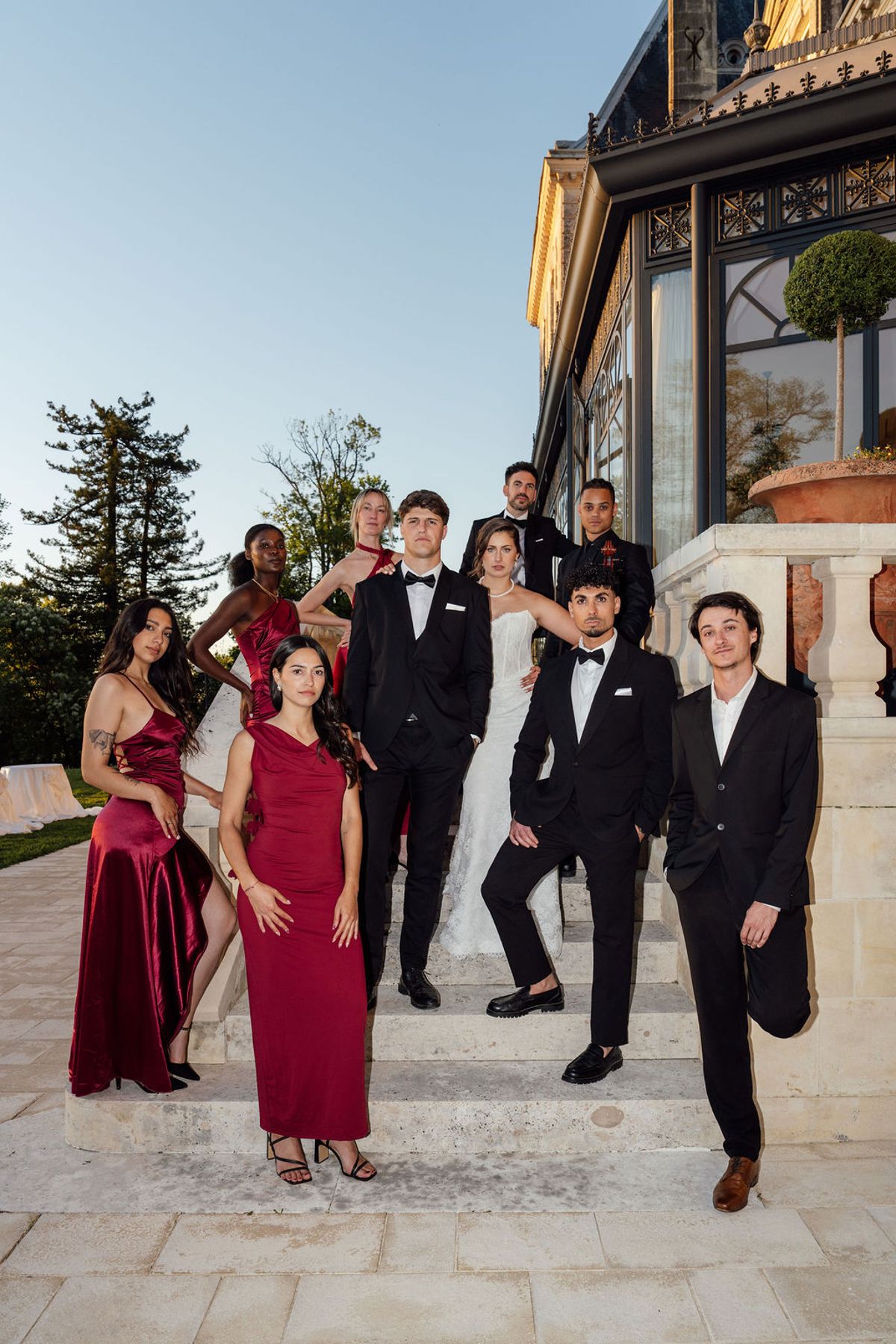 Styled shoot models Harper and Liam: the full wedding party at golden hour on the terrace, Chateau de Mirambeau, spring editorial