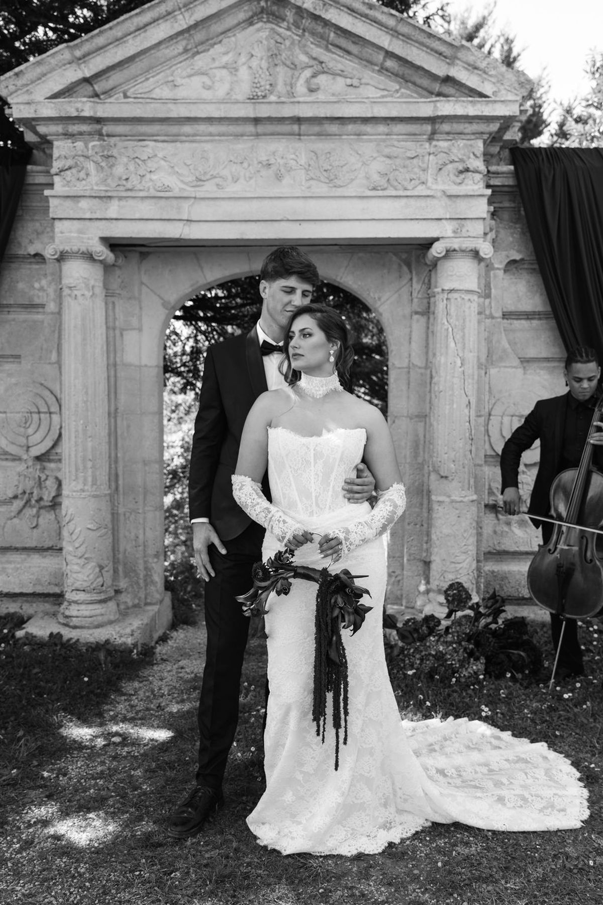 Styled shoot models Harper and Liam: a black-and-white portrait of the couple walking together, Chateau de Mirambeau, spring editorial