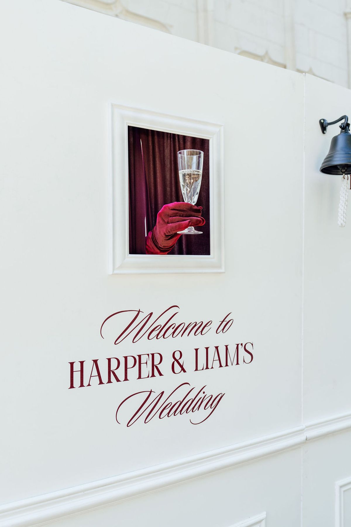 Styled shoot models Harper and Liam: the welcome wall beside a burgundy-draped champagne nook, Chateau de Mirambeau, spring editorial