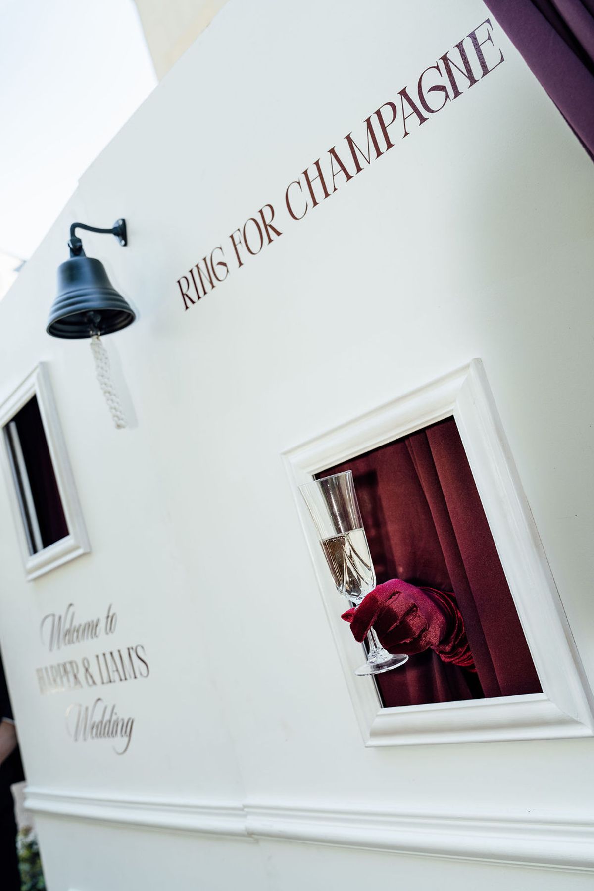 Styled shoot models Harper and Liam: a close view of the champagne nook and burgundy drape, Chateau de Mirambeau, spring editorial