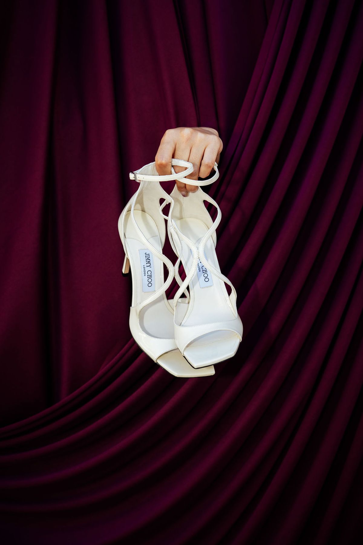 Styled shoot models Harper and Liam: the ring-for-champagne bell signage in close-up, Chateau de Mirambeau, spring editorial