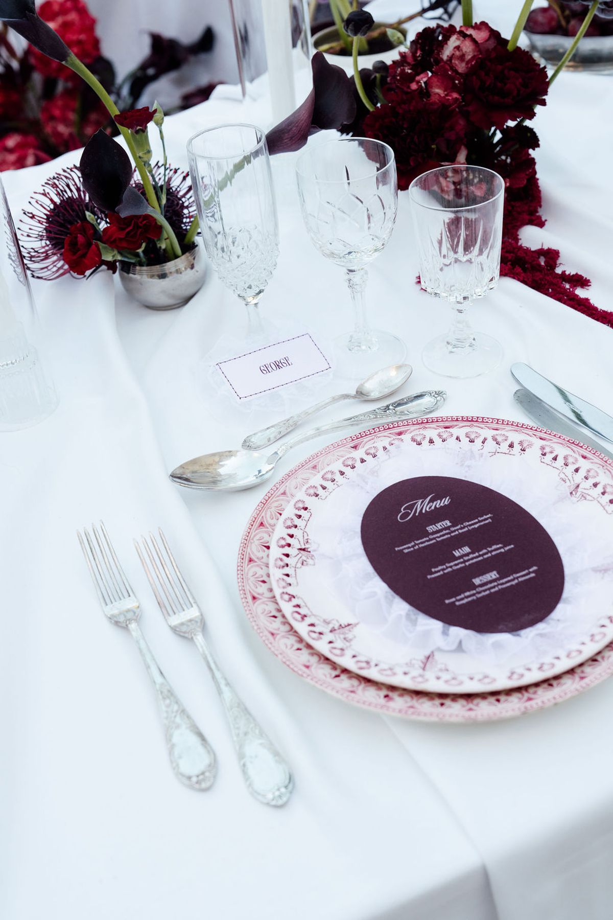 Styled shoot models Harper and Liam: a place setting with a hand-lettered menu card, Chateau de Mirambeau, spring editorial
