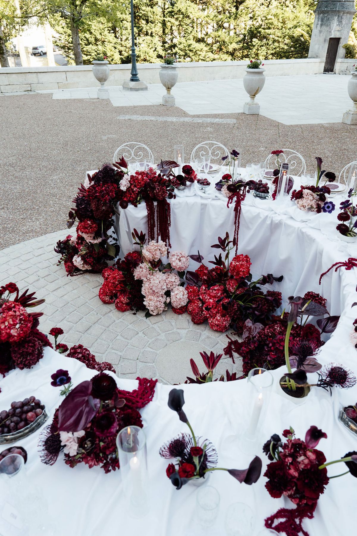 Styled shoot models Harper and Liam: the floral table runner in close-up, Chateau de Mirambeau, spring editorial