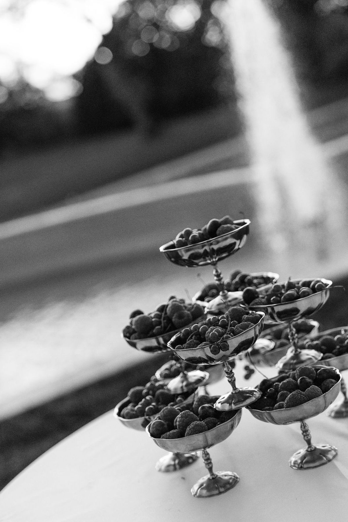 Styled shoot models Harper and Liam: a black-and-white macro of the dessert table, Chateau de Mirambeau, spring editorial