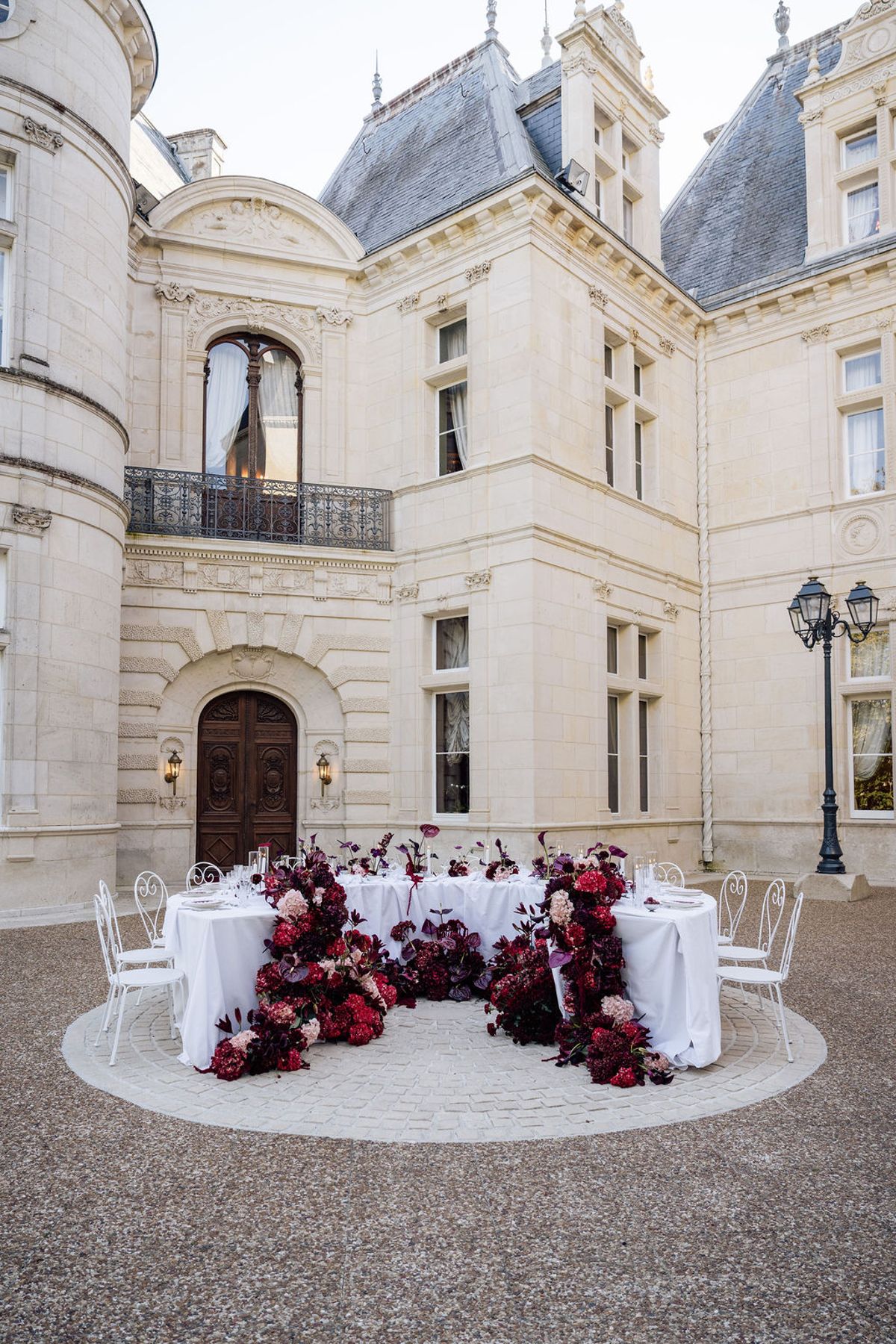 Styled shoot models Harper and Liam: the Jimmy Choo heels set against the burgundy drape, Chateau de Mirambeau, spring editorial