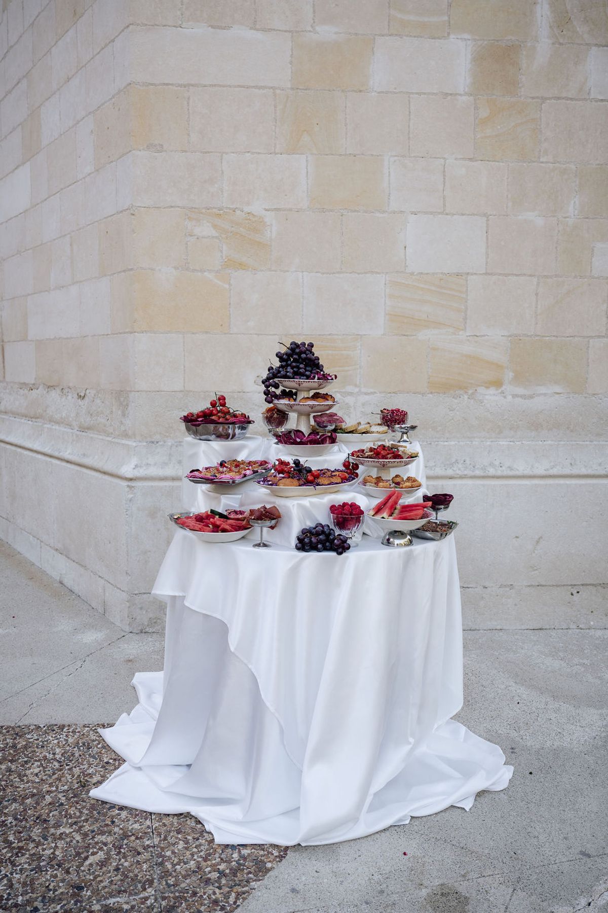 Styled shoot models Harper and Liam: the tiered grazing table of fruit and pastries, Chateau de Mirambeau, spring editorial