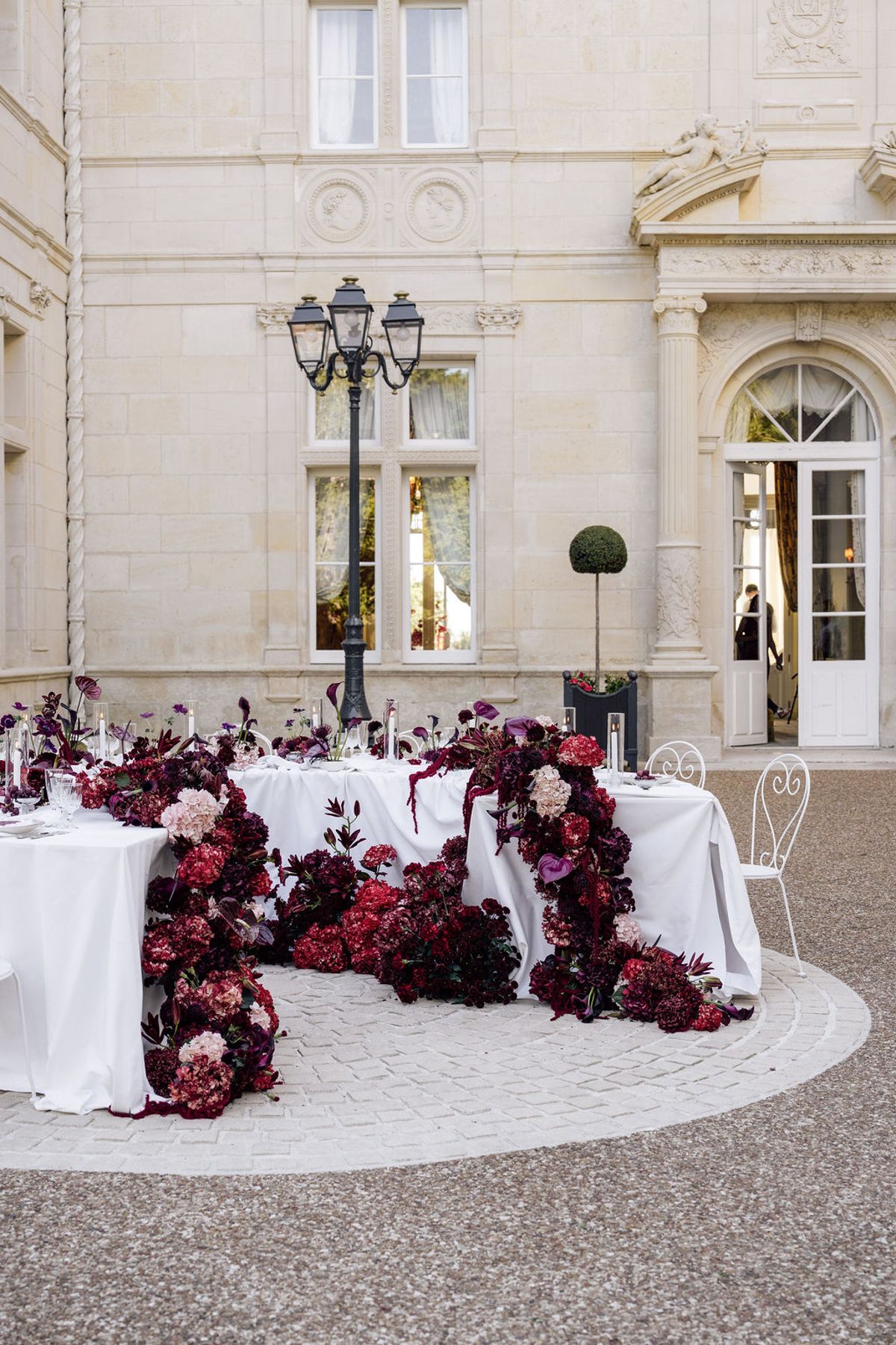 Styled shoot models Harper and Liam: the chateau's facade and entrance courtyard, Chateau de Mirambeau, spring editorial