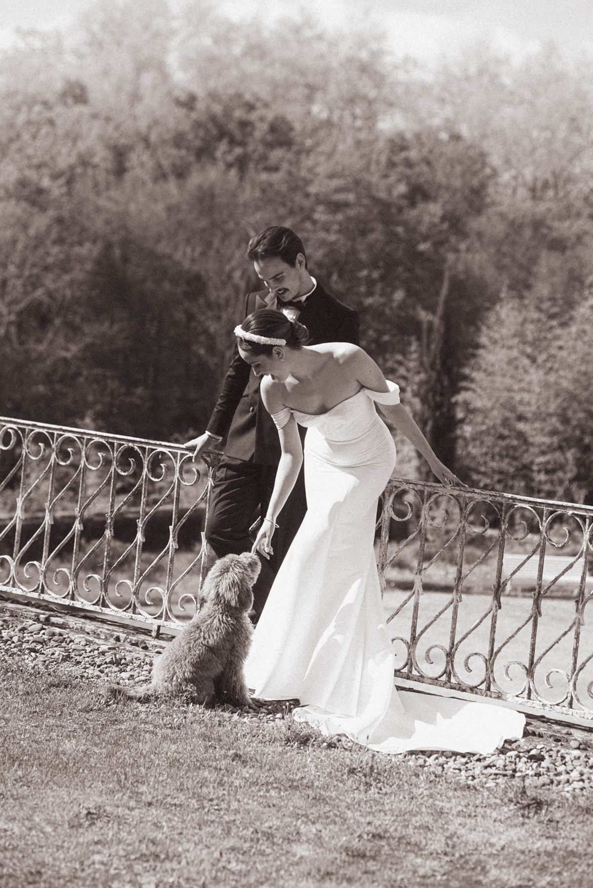 Couple with dog on lawn at Chateau de Campet
