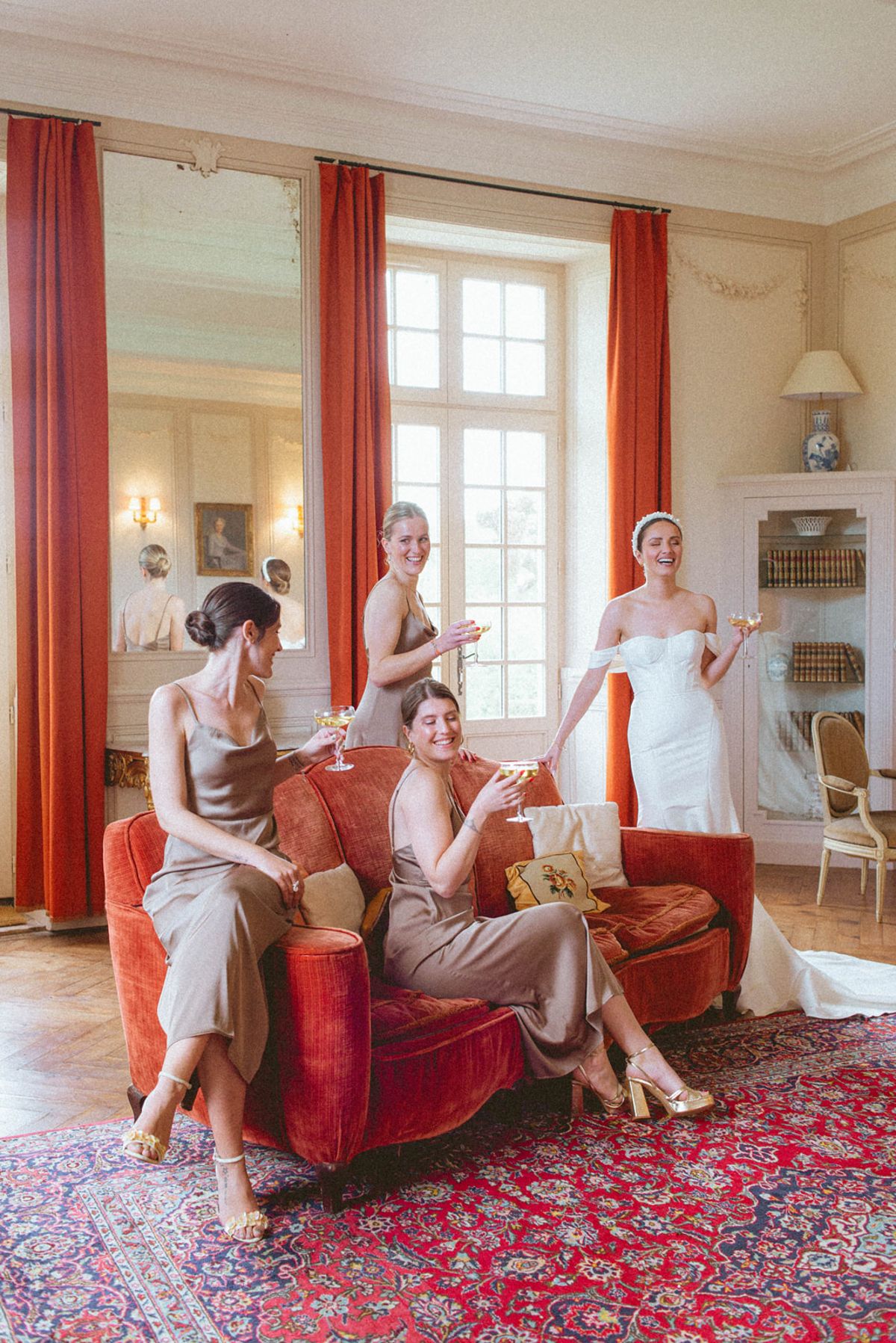 Bride and bridesmaids with champagne at Chateau de Campet
