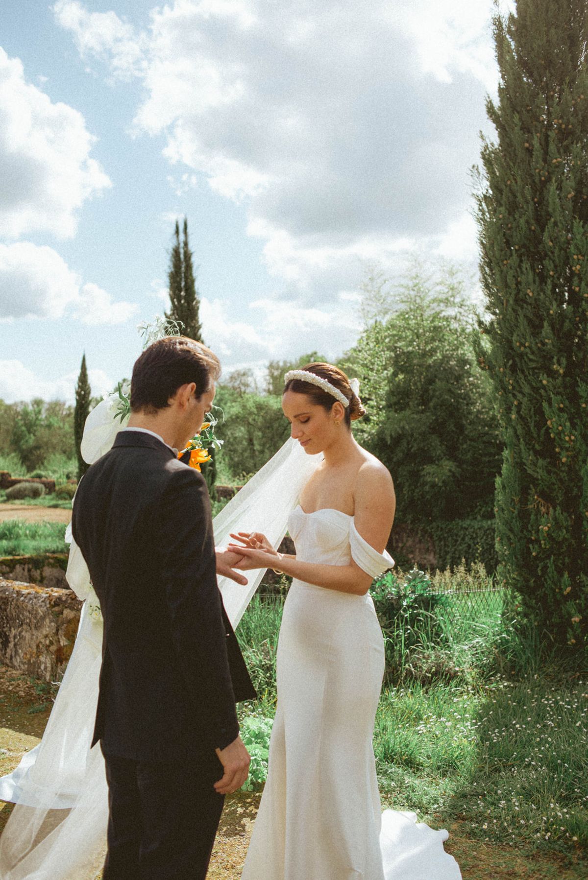 Ring exchange under cypress trees at Chateau de Campet