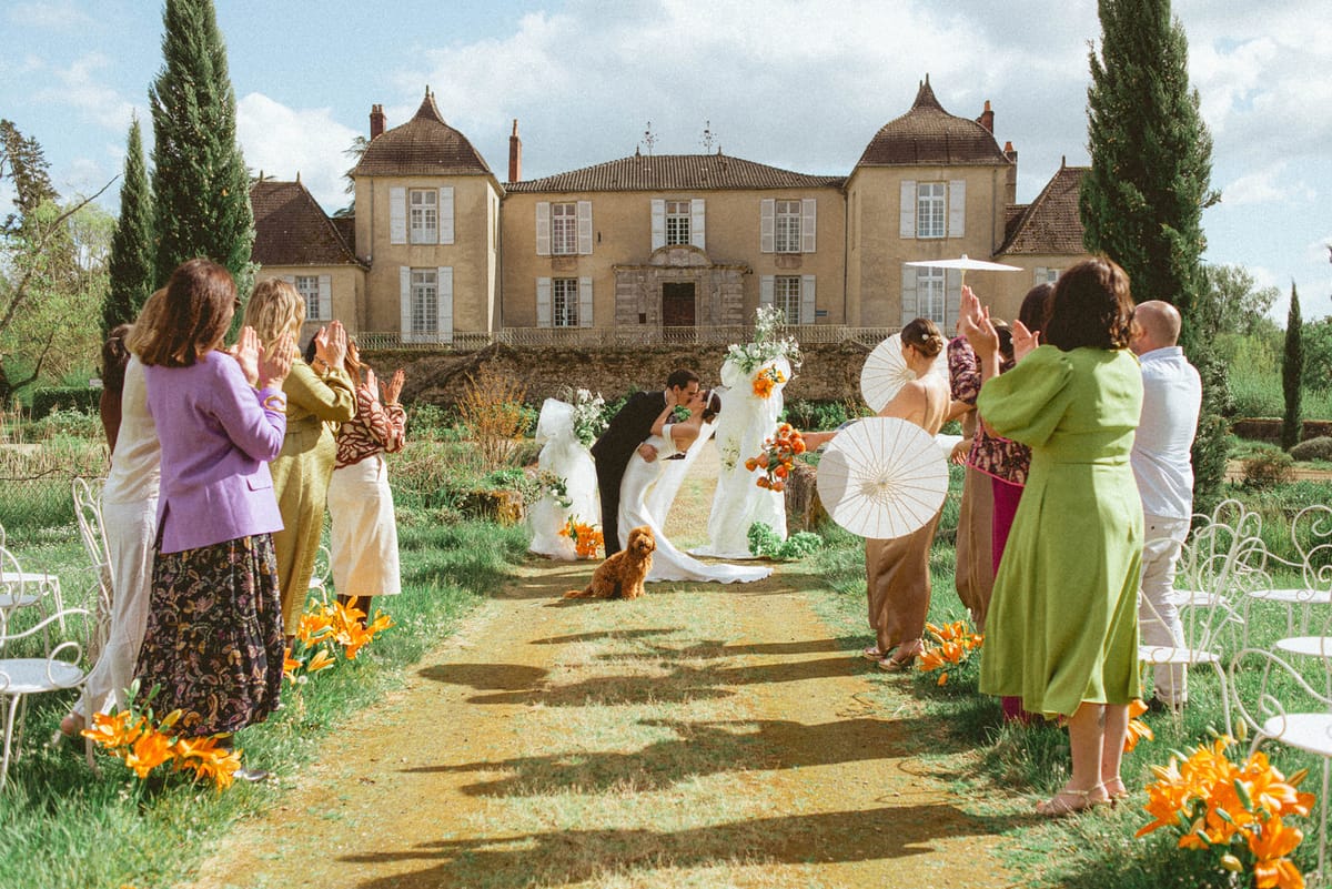 First kiss dip at ceremony at Chateau de Campet