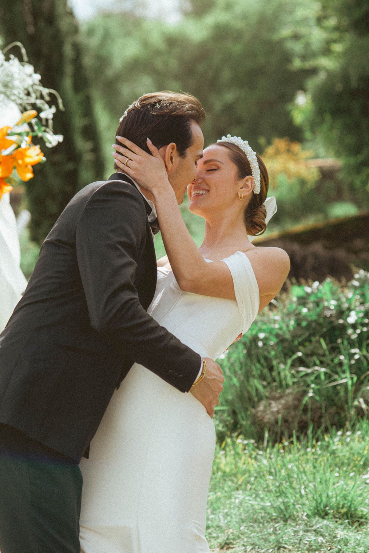 Couple kissing at ceremony at Chateau de Campet