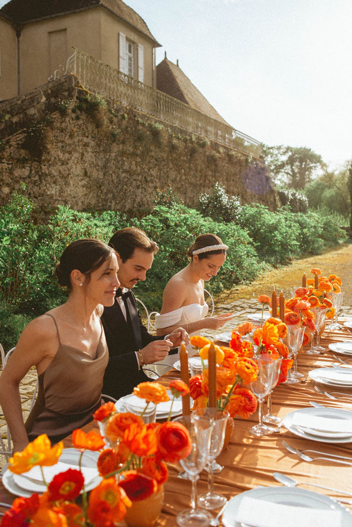 Orange-palette garden reception at Chateau de Campet