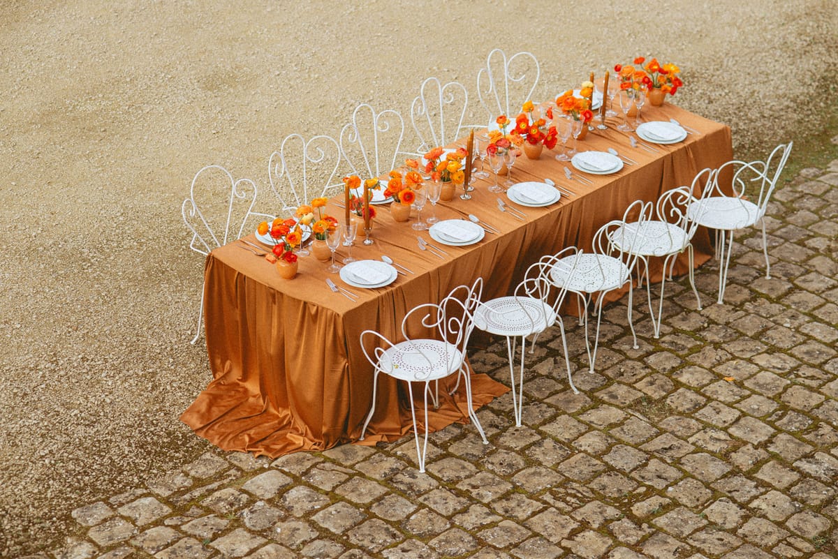 Orange-palette garden reception at Chateau de Campet