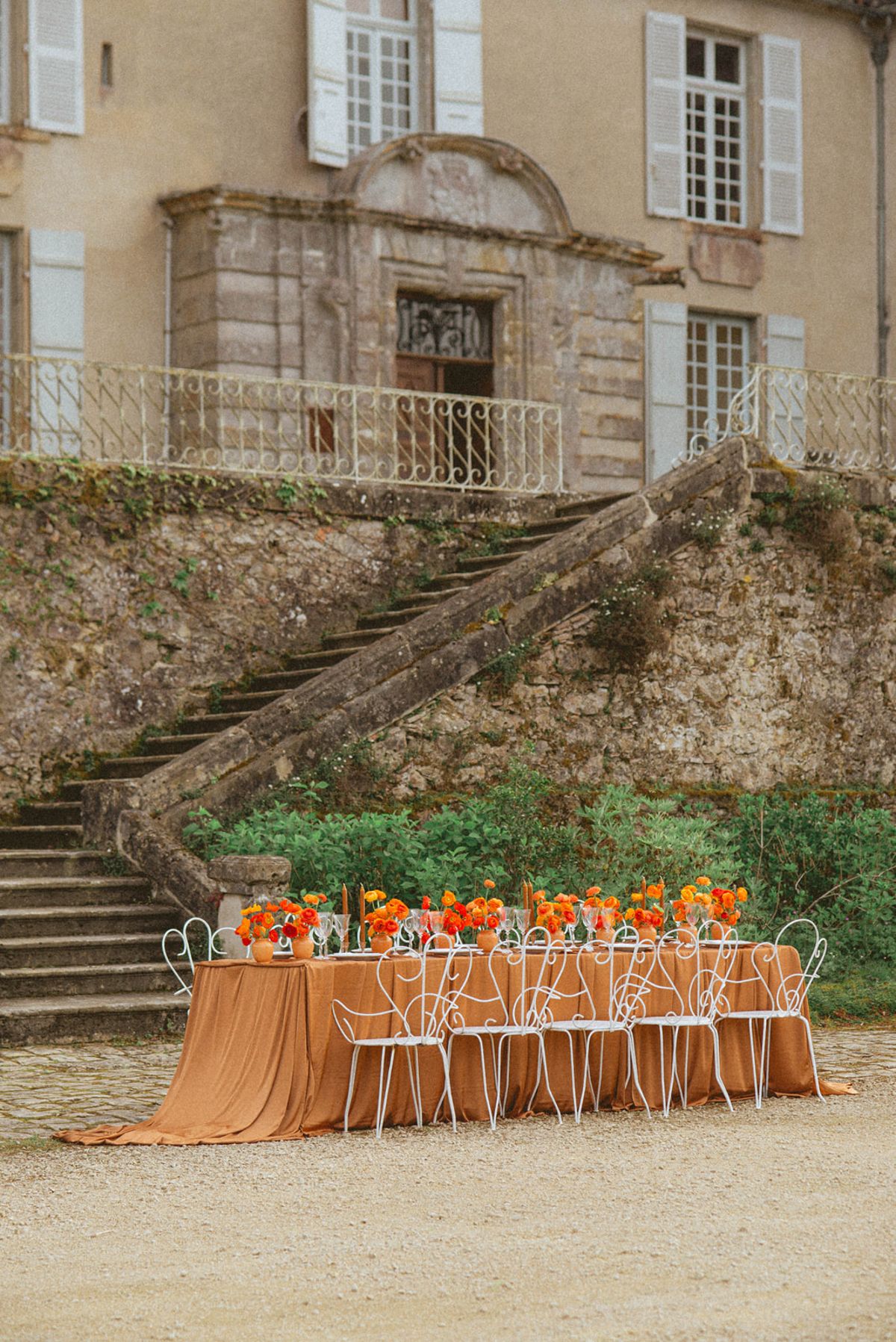 Orange-palette garden reception at Chateau de Campet