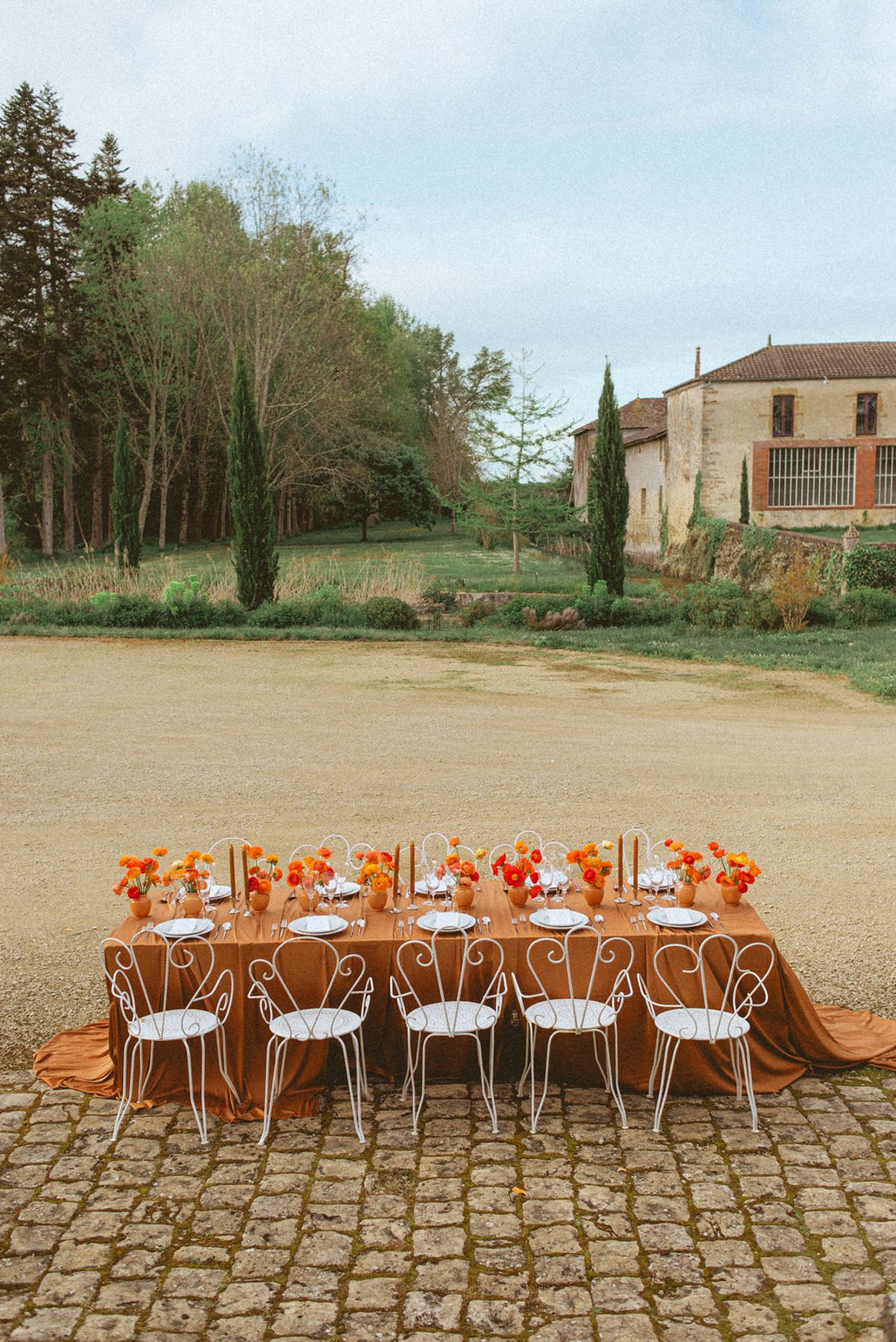 Orange-palette garden reception at Chateau de Campet