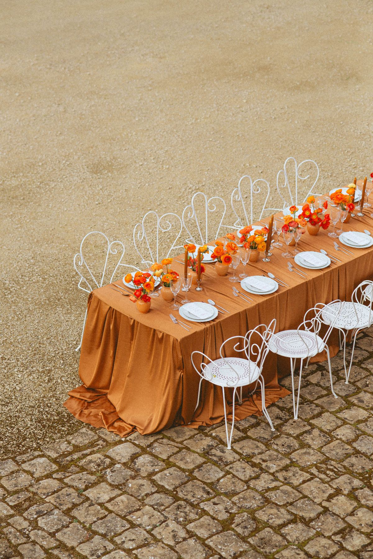 Orange-palette garden reception at Chateau de Campet