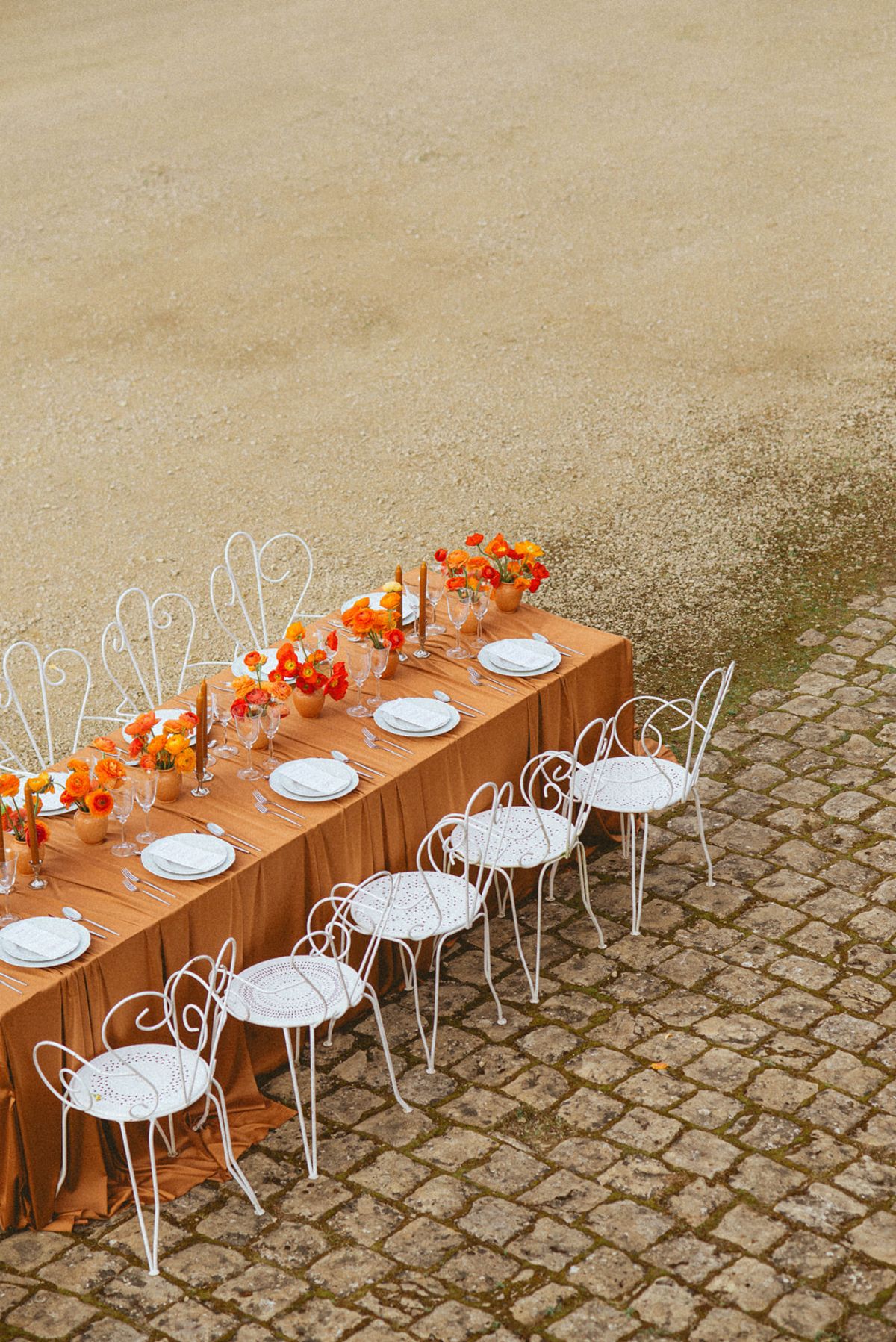 Orange-palette garden reception at Chateau de Campet