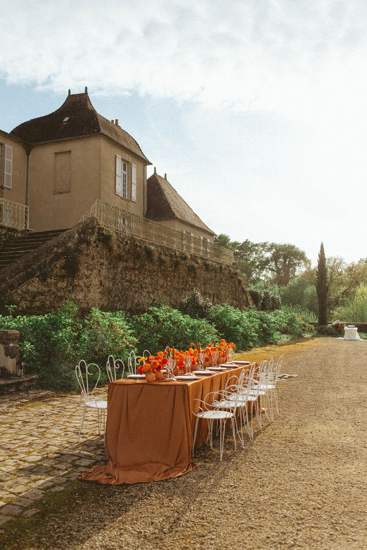 Orange-palette garden reception at Chateau de Campet