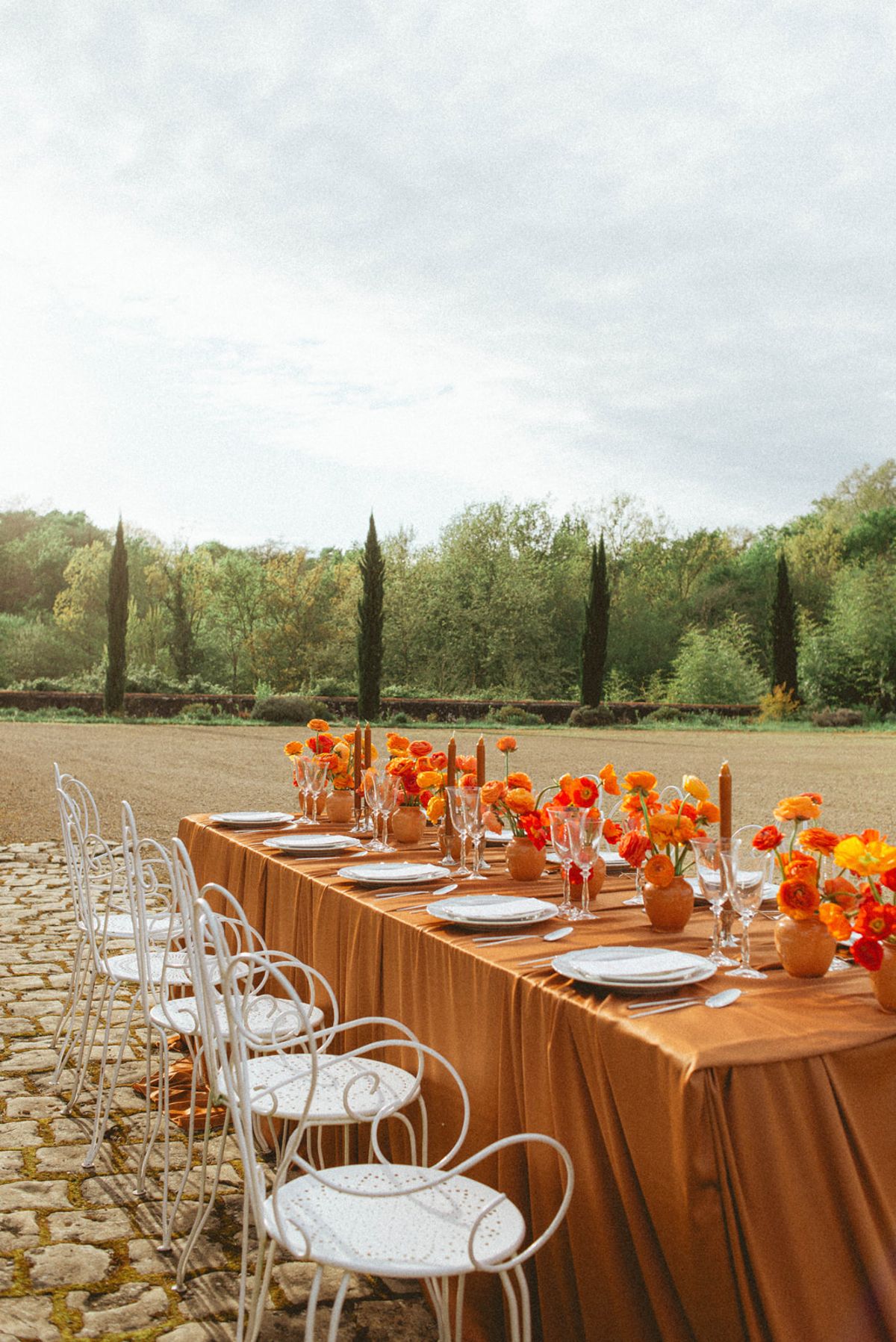 Orange-palette garden reception at Chateau de Campet
