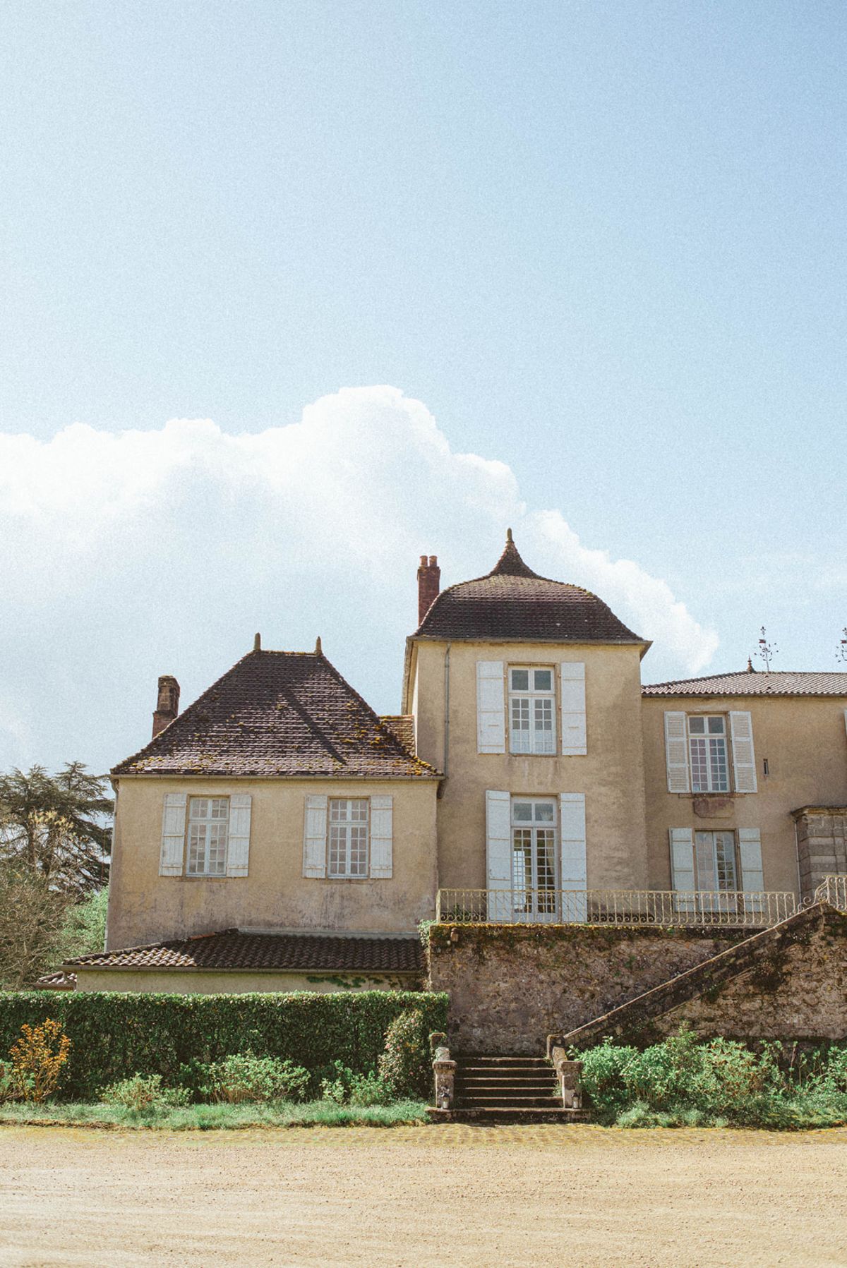Stone facade and gardens at Chateau de Campet